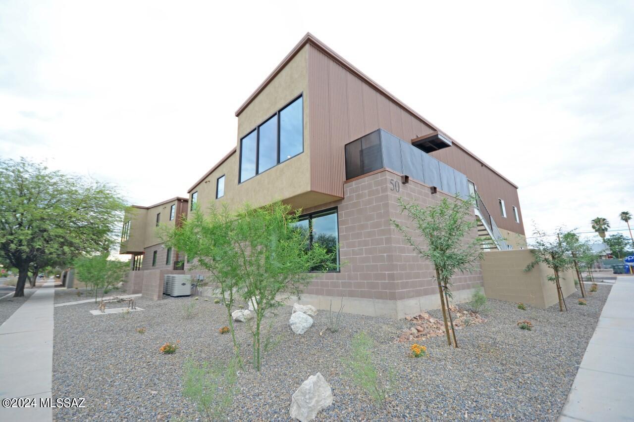 Rare opportunity to purchase newer construction within 3 blocks of UofA around a 8.06% Cap rate (proforma)! Seller Financing Available @6% for up to 5 years OAC with 30% downpayment. This newer building integrates metal roofing with block and stucco finishes for a really neat modern look that the students love. 4-plex, with 8bds/3.5bths per unit. Large units with huge common areas, all tile throughout, hardwood cabinets, corian counters, and ample appliances. Floorplan designed by afor students. Huge Picture windows in front frame nice mountain and city views. Large enclosed common area with Turf. Parking lot w 14 parking spots, 4 on street parking spots available, basketball hoops. This property is zoned for group homes and could be ideal for a variety of non-student housing needs.