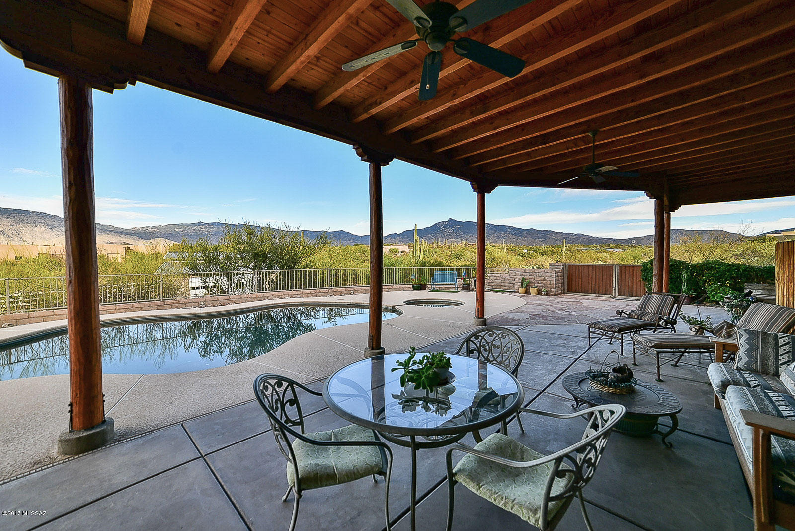 Pictures do not do this home justice.  Incredible custom home  over 2 acres of prime horse property located in the Coyote Creek Equestrian development.
Panoramic views of the Catalina mountains, inviting Pebble Tech pool and spa. Putting green for the golf lover.  Loads of natural light fill this 4 BDR 3 BA home. Features included beamed ceilings, split bedroom plan with large master suite, separate guest quarters, 8 foot  alder doors, stainless steel appliances, roll up window screen and door screens, surround sound, custom window coverings, Jacuzzi tub in the master, Insta-hot water in kitchen.  Mature citrus trees & desert landscape on drip systems.  24  x 26 Barn Master metal barn, 2 stalls, rubber brick walkway tack area, misters & fly sprayers - all portable.