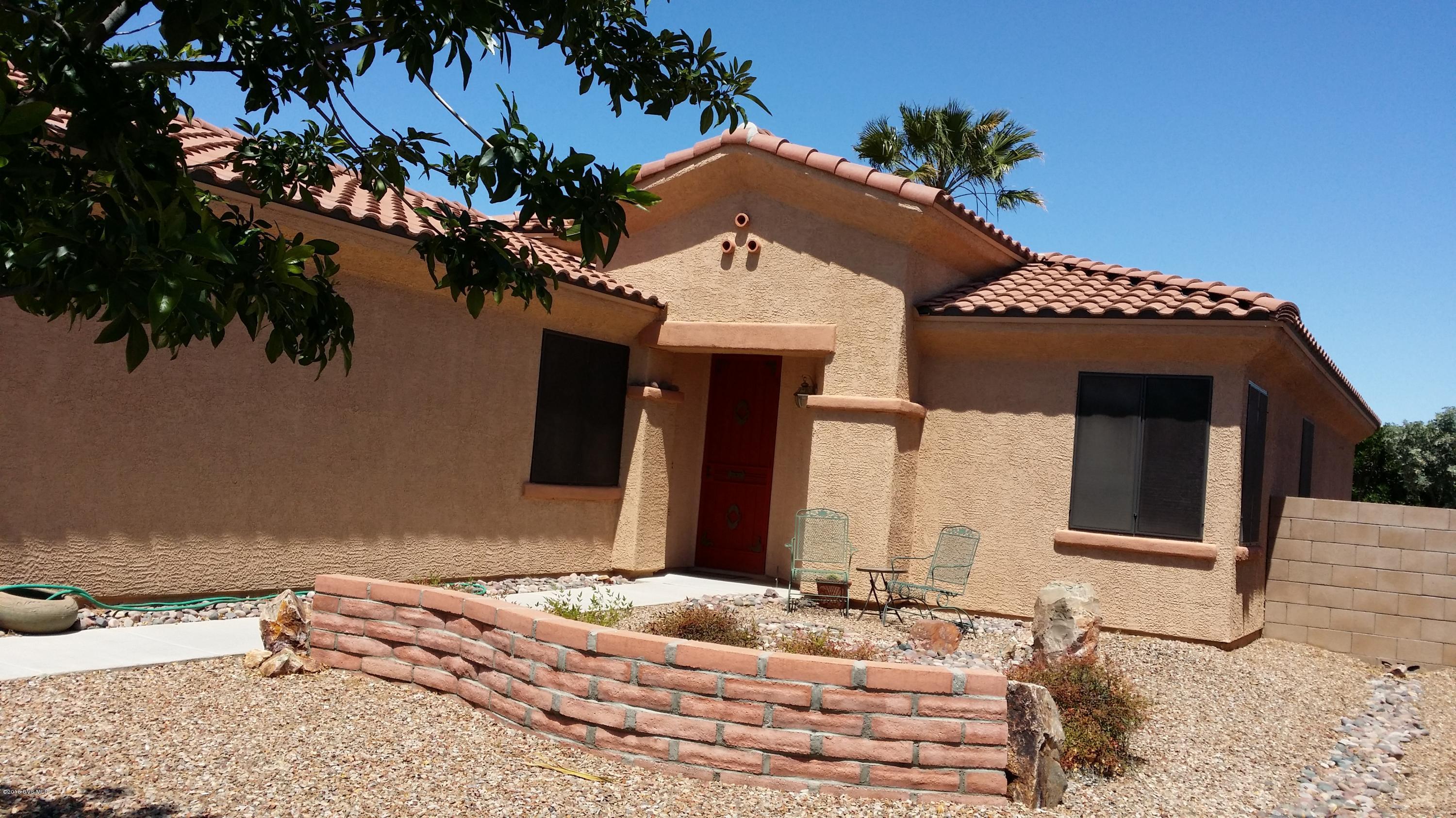 Larger home on Northeast side of Green Valley/NO GVR/2 great size BR's and a DEN/over 1700 sq. ft./Full window size pass through from Kitchen to LR/DR/bookcase wall in living room for your over sized TV/Home built in 2005/fruit trees & hedge of flowers in backyard/pots & pan rack & island in kitchen stay with house/Kitchen table also stays/one year home warranty/