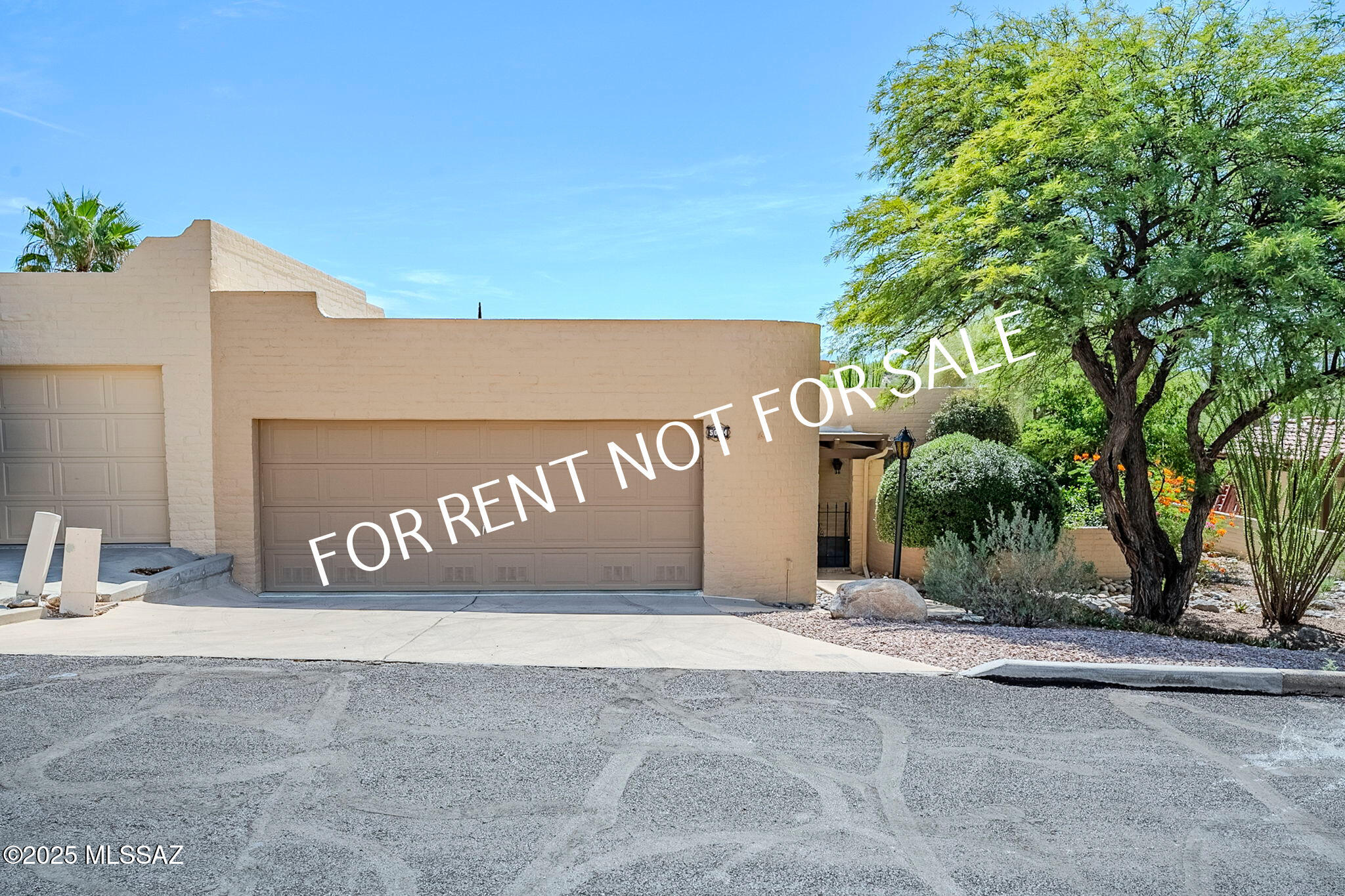 Built 1978 - 3 BED-2 BATH 2041 SQ FT - This well-maintained end unit offers exceptional privacy, stunning views, and an inviting layout perfect for comfortable living. Enter through a beautifully manicured courtyard with a tranquil fountain and cozy sitting area. Inside, you'll find a spacious great room with a dining area and bonus room, ideal for a home office or den. The fireplace features an electric insert for added ambiance. The updated kitchen showcases maple and glass-front cabinets, deep pull-out drawers, and a generous eat-in breakfast area. Appliances included: refrigerator, electric stove/oven, built-in microwave and dishwasher. All bedrooms are generously sized— the primary suite includes a large walk-in closet, and the oversized guest bedroom offers additional space for guests or hobbies. A full laundry room with washer and dryer is also included. Both the living room and primary bedroom feature sliding glass doors that lead to a fully enclosed patio. TFS solar panels providing cost efficient, environmentally friendly solar energy. Included in rent: Monthly landscape service for trees and shrubs only. The wraparound backyard creates multiple peaceful sitting areas, perfect for relaxing or entertaining. Community amenities include Pool & Spa and Pickleball Courts. Located just minutes from Sabino Canyon, nature trails, shopping, and dining, this home offers the perfect blend of serenity and convenience. Pets are subject to approval. **Please visit our website for SECURITY DEPOSIT, PET RENT, & NON-REFUNDABLE PET FEE INFORMATION.