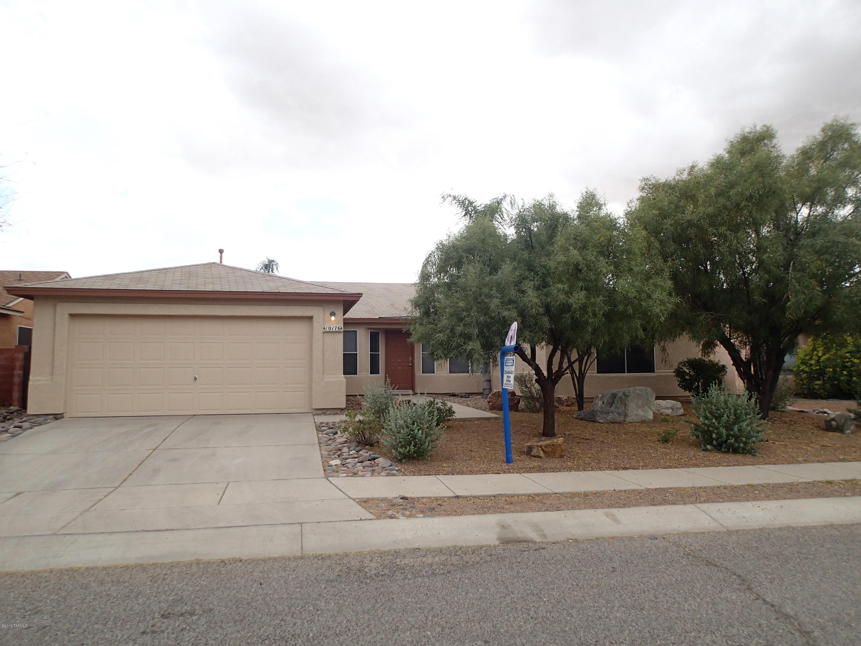 This spacious home has been freshly painted inside and out.  The front door opens to the living room and formal dining area with east and west wings set in a split bedroom layout, and kitchen and family room straight ahead. Off to the right is the master bedroom and master bathroom with dual sinks, a garden tub, separate shower and walk-in closet. Turning left before reaching the kitchen will take you to the east wing which houses three guest bedrooms, the laundry area and 2 car garage. The kitchen is open to the big family room with fireplace and a breakfast nook with bay window to the covered patio and nicely landscaped back yard with mature vegetation. There are lots of ceiling fans / lights and the floors are all solid surface for easy care and durability. Come see it today!