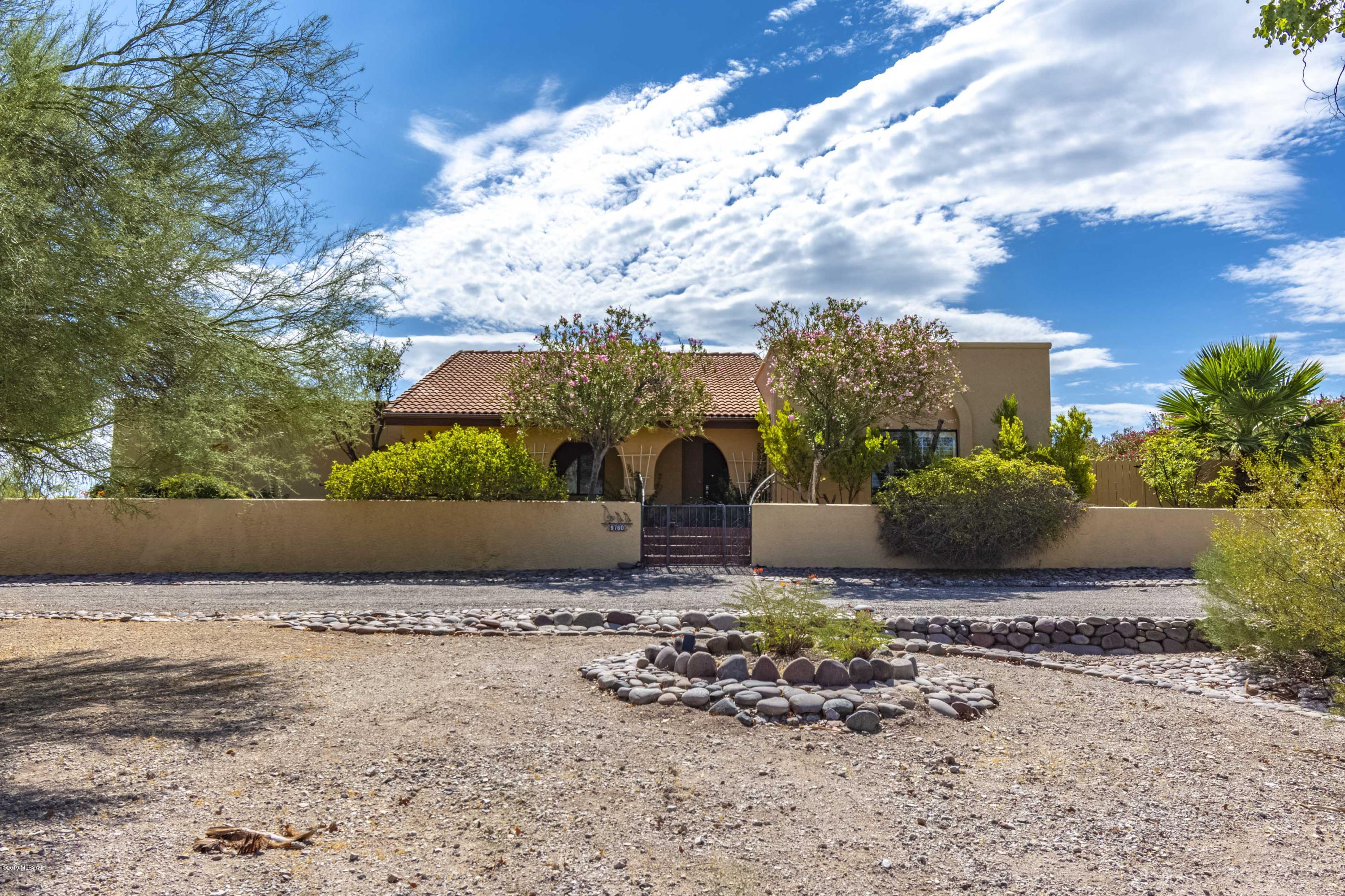 Welcome to Backyard PARADISE with mountain views all around.  Walk into a large living room with a rock fire place as the centerpiece.  The home has 3 bedrooms, 2.5 bathrooms, tile throughout the home, granite counter-tops, spacious master bedroom and walk-in closet, over sized 2 car garage, and almost full acre.  Priced to sell!!
