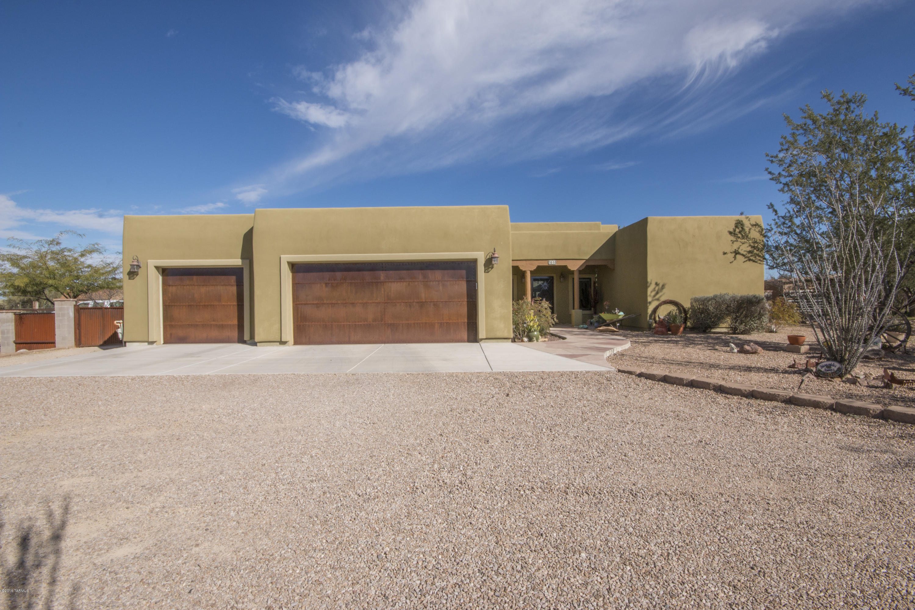 Seller entertaining offers $475K-$499K! Welcome to your new home! 2,282 sq.ft. with wonderful custom Knotty alder cabinets/doors, granite counters in kitchen & baths, S.S appliances, stained concrete floors, 4bd/2ba. On demand tankless gas water heater, Pella windows & doors w/ interior wood blinds. Backyard has pool w/ dual cabanas in a beautiful landscaped walled yard .Behind a 40x40 metal insulated shop where you can Build Hot Rods, ample storage for quads & an enclosed RV garage for your 5th Wheel! Come w/ a 6 car garage. Double wide electric gate provides access to the back. A circular drive takes you to the 3 car garage with metal rusted doors & colored ''drive-it'' Stucco in a smooth finish. This is a custom home close to everything, but a quiet paradise ''away from it all!''