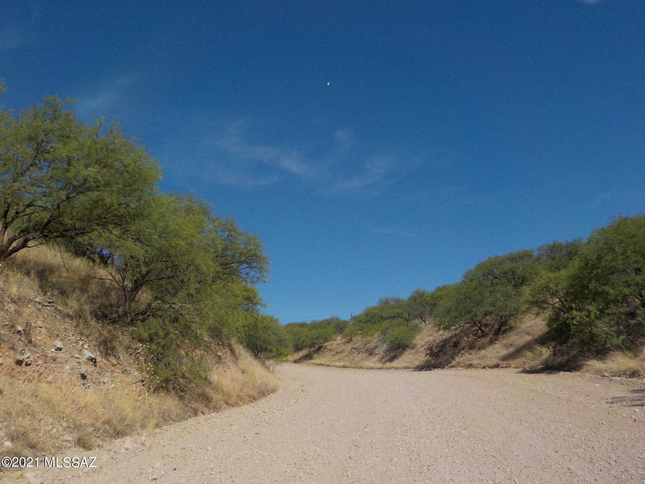 Seller motivated!   Beautiful 2+ acres of land ona hilltop and at a very affordable price.   Build your dream home on thi serene desert surrounded by breathtaking views of the nearby mountain ranges.   Centrally located in Rio Rico.   The lot faces north/south offering 360 degree views from it's hilltop.   Own a piece of Arizona today!