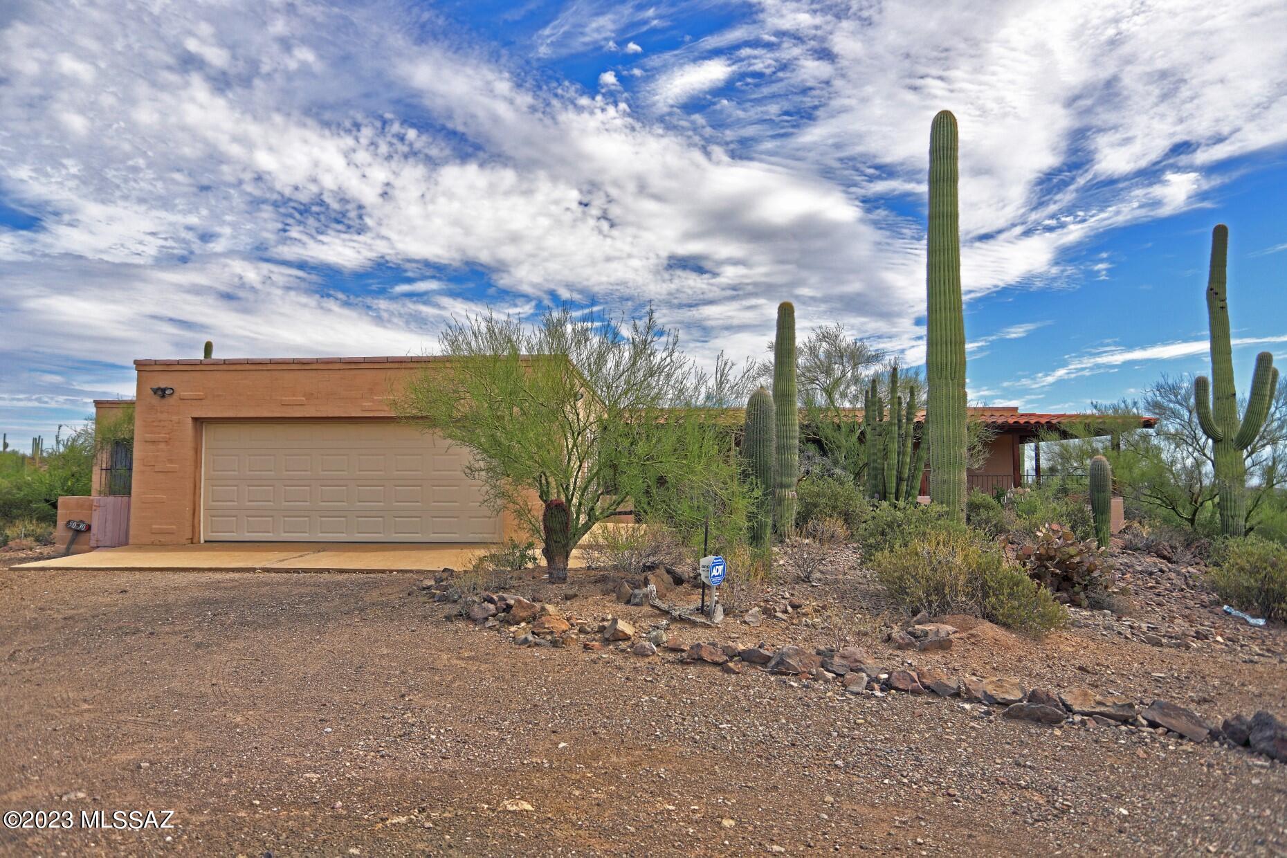 With more than 2850 square feet situated on 1.32 acres, this home is ready for you to make it yours! Built in 1979, this home was top of the line with a sunken living room, ammenities such as a built in ironing board and folding counter in the laundry,built in toaster in the kitchen, a Roman tub in the master bath, sautillo tile in wet areas.  Check the photos carefully, home needs to be updated, but once done, it will be an awesome abode.  The site is superb, looking to the mountains with city views.  Close to Pima College West, the Tucson Mountains, downtown, shopping and religious institutions, it is the best of all worlds, a feeling of ruralness yet close to the hustle and bustle of downtown.  Scoop up this deal and make it your
forever home! Private spacious home on 1.32 lush desert acres in desirable Casas Colina Cabo in Tucson Foothills.  This property is offered for sale at a  price which permits funds for upgrading for the diy buyer or for an investor.  Check the photos carefully and you will see this 2838 square foot home has plenty of potential and is sited for spectacular mountain views as well as panoramic city views.  If the home were upgraded, the price would be considerably more.  Location is a plus, close to downtown, Pima College West, the University of Arizona and the Tucson Mountains- for hiking.