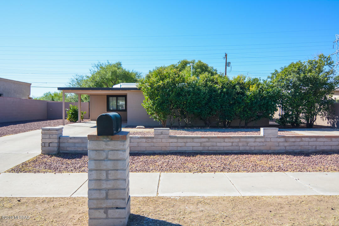 Beautifully updated Ranch style home. Located in a convenient South Tucson location. Rich earth tone ceramic tile. Spacious kitchen with island and white appliances. Updated cabinets and countertops. New custom interior and exterior paint. New upgraded carpet in bedrooms. Nice back yard with mature vegetation and covered porch. Triple pane windows. Upgraded door hardware and light fixtures. This home shows beautifully.