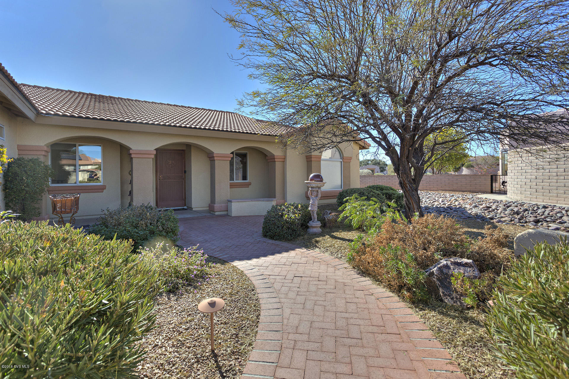 Pierce built Barcelona model on almost 1/2 acre corner lot, quiet central location, very nice mountain view, 3 BR + office, 2 bath, tile roof. Upgrades include new cooling and heating April 2017, expanded master bedroom, rollout shelves in the kitchen cabinets, upgraded light fixtures, built-in wall bed unit in guest bedroom, water softener and more. List of all improvements available with each showing. Low HOA dues. Agent is related to seller.