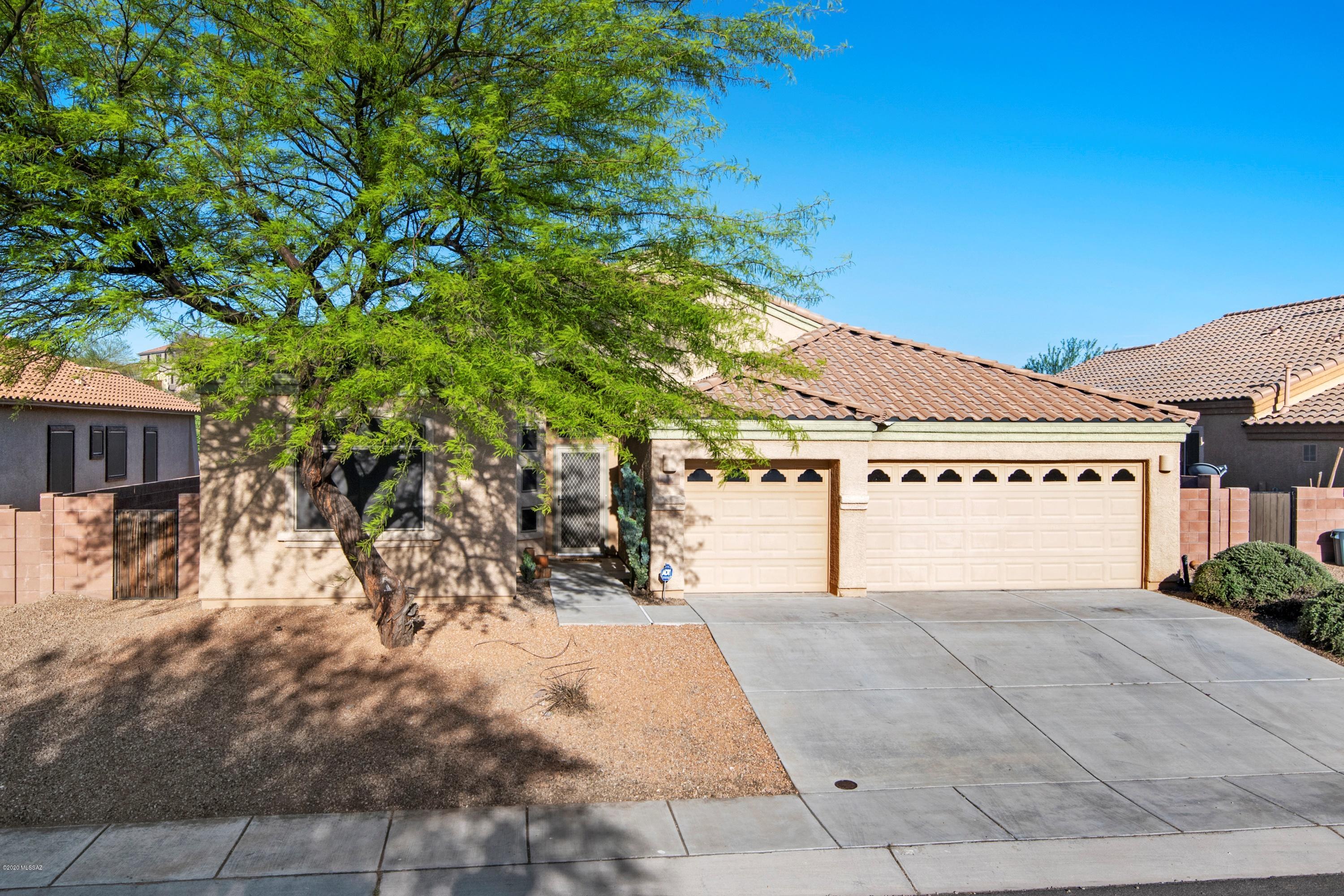 Beautifully renovated 4 bd/2bth home in Madera Highlands.  Popular Everest floor plan home built by Lennar.   New wood-look tiles in the living/dining area.  Interior & 3 car garage is freshly painted.  Granite counter tops in the kitchen.  Plenty of space with the kitchen nook, formal dining and a breakfast bar. Home features a living room as well as a bonus/entertainment room.    Both bathrooms include double sinks.  Large walk in closet in the master.  The best point of the home is the oversized lot allowing for a huge backyard - pavers, fire pit and no neighbors directly behind.  (Virtual tour available.  Agent related to seller.)