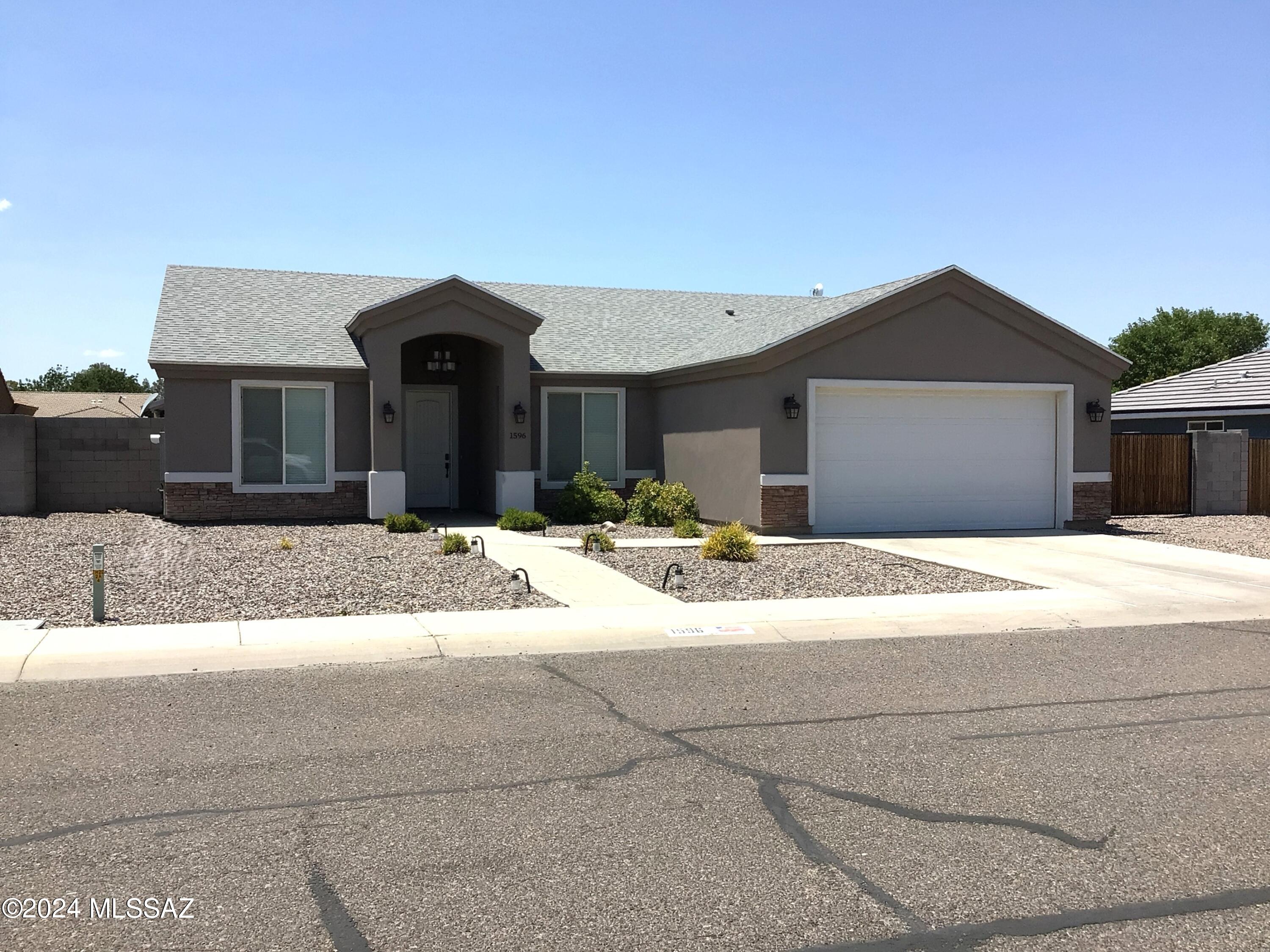 Built in 2018, this 4-bedroom, 2 bathroom 1630 sq ft beautifully maintained home in a nice neighborhood with sidewalks is ready for its new owners to just move in and enjoy. It starts with a low maintenance yard, 2 car garage nice foyer area that flows into open concept living room, dining room and kitchen.  Split bedroom plan with two bedrooms to the south the 4th bedroom/office at the front of the home and primary off kitchen.  The primary bedroom has natural lighting, ceiling fan, and a large bathroom with double vanity and walk-in closet.  The back yard is made for entertaining with new metal roof pavilion, concrete slab, pavers and real grass.  This is a must-see home.