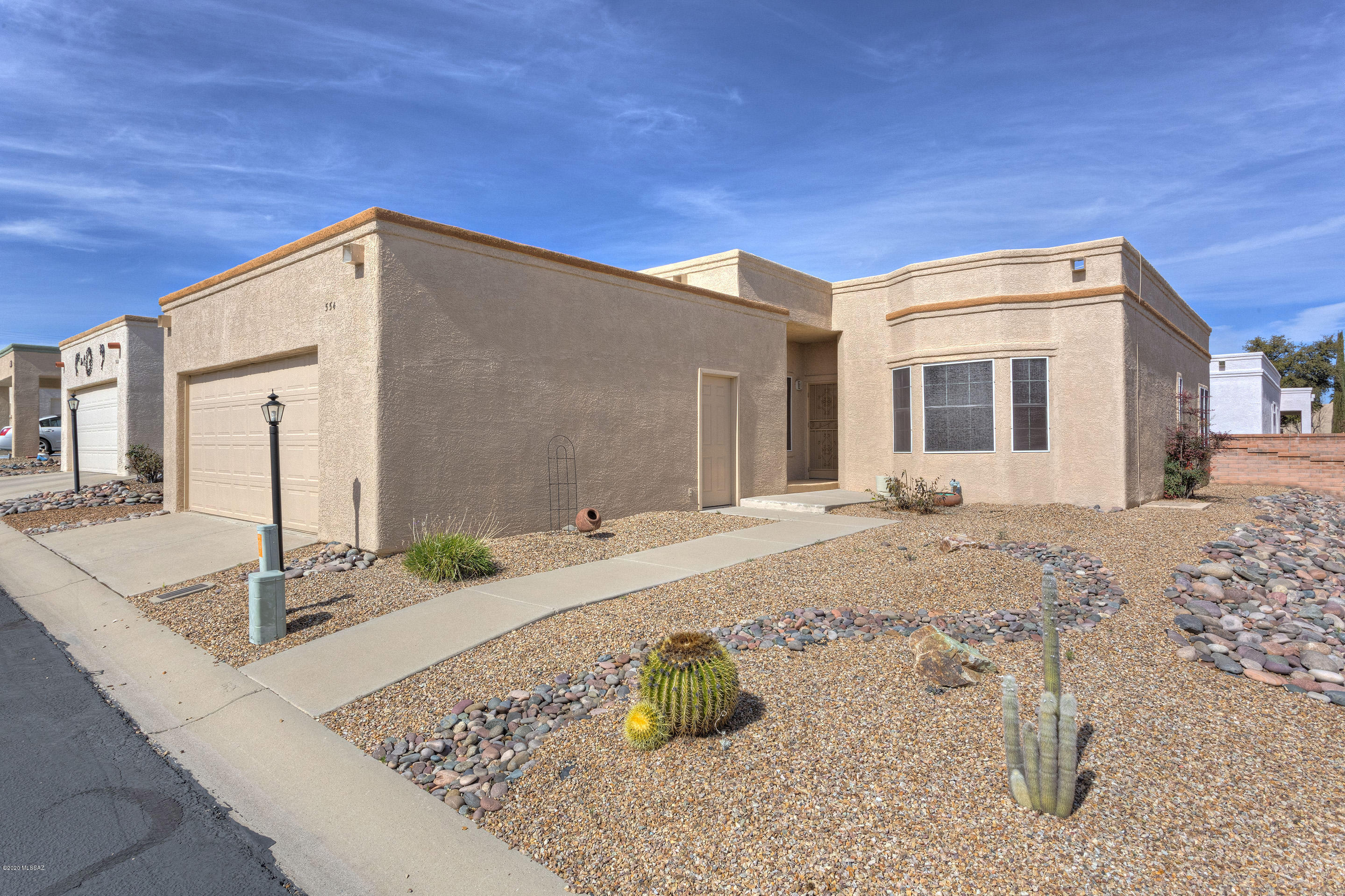 Lovely updated home on 2 lots in popular Canyon View Estates with its own Recreation Center, pool, spa, activities and fitness room gives you the best of both worlds! The large lot gives you room between your neighbors in a community with lots of amenities for your retirement. GVR is not mandatory but is available.  Updated with beautiful wood laminate flooring, this well laid out floor plan has no wasted space! The numerous windows bring in lots of natural light to this 2 bedroom, 2 bath home. The large kitchen has stainless appliances including stainless gas range, a huge kitchen nook, and laundry room closet. The master bedroom suite features a bay window. Ceiling fans, window treatments and furniture available by separate bill of sale make this a very attractive turn-key winter retreat