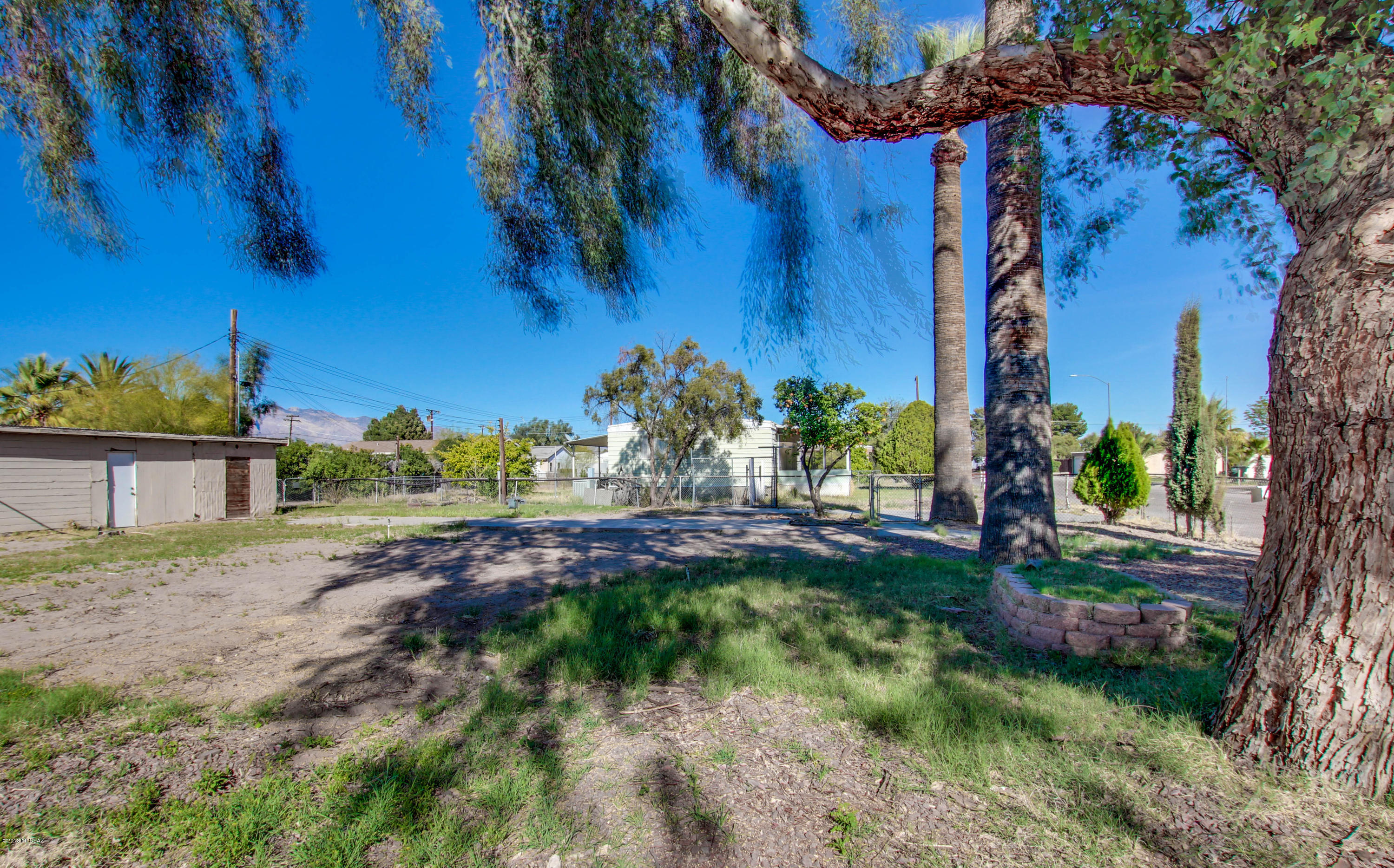 Great corner lot. Completely fenced in with beautiful mature trees. There is a 10x50 storage building. Lot ready for the perfect home. Mobile was removed all utilities available.