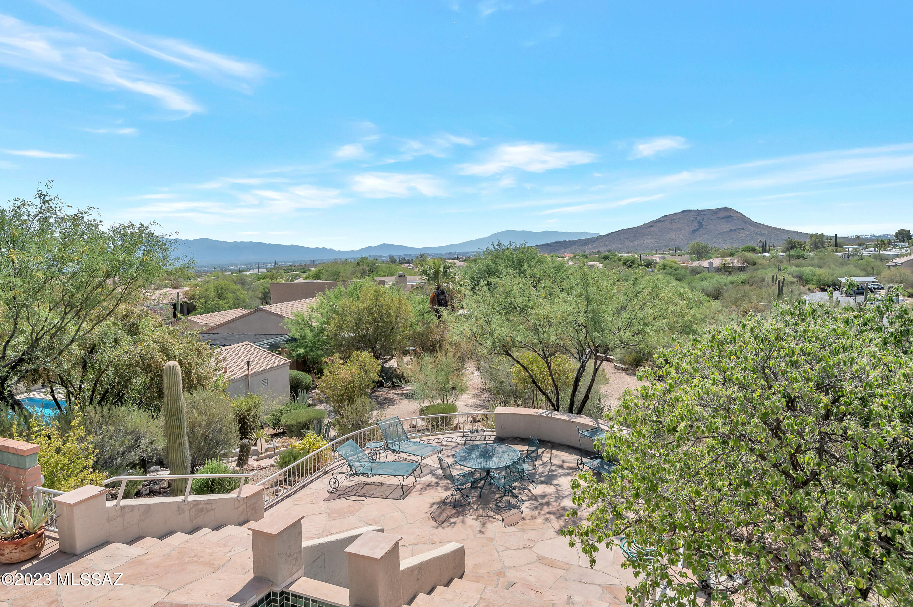 Located in the Hills of the popular Starr Pass Resort Community. This unique and charming Pueblo Style Home is positioned on a cul-de-sac with a private Court Yard Entry & a lovely Mesquite Tree shading the Front Yard on a large 0.285 Ac Lot. Features include Plantation Shutters, updated Kitchen with Natural Stone Counter Tops, pullout Cabinet Drawers, Stainless Appliances, Custom Whole House RO Water System with Water Tec maintaining the System, Fas FP, downstairs Guest Bedroom, Bath and Laundry closet. Owners suite upstairs with private Balcony, new Bathroom Tile (July 2023) and Loft/Office with private Balcony. A tiered Back Yard with Mountain Views and a Lush cook out area to the side of the house. Fountain in an ''As Is'' condition. Storage in the 2 Car Garage. Community rec, pool, sp