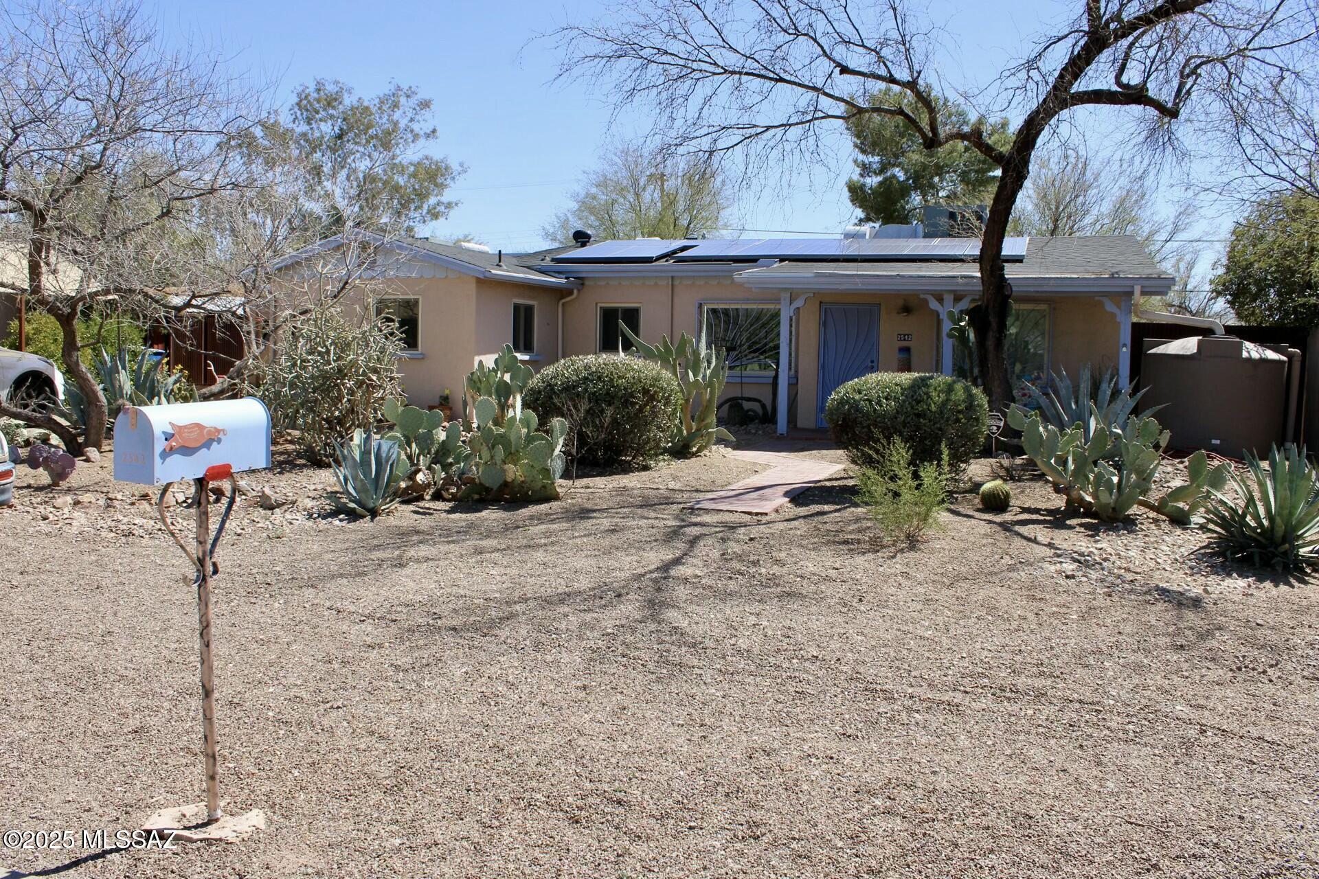 This gorgeous bungalow has 3 bedrooms and 2 bathrooms with stunning upgrades while still keeping the 1948 charm that the neighborhood is so famous for. The kitchen has been redone with new cabinets, granite counters, large peninsula, and SS appliances. Each bathroom has been meticulously updated with a modernized SW charm while paying homage to 1948. This home has a split floor plan with a completely redone laundry pass through between wings of the home for added connivence as well as SW tile throughout. Have peace of mind with the 2024 roof, PEX water pipes, dual pain windows, leased solar (to be fully paid) for low electric bills, two water catch tanks along with 2 large sheds. All of this sitting on a beautiful .228 of an acre down the street from parks, shops, and restaurants!