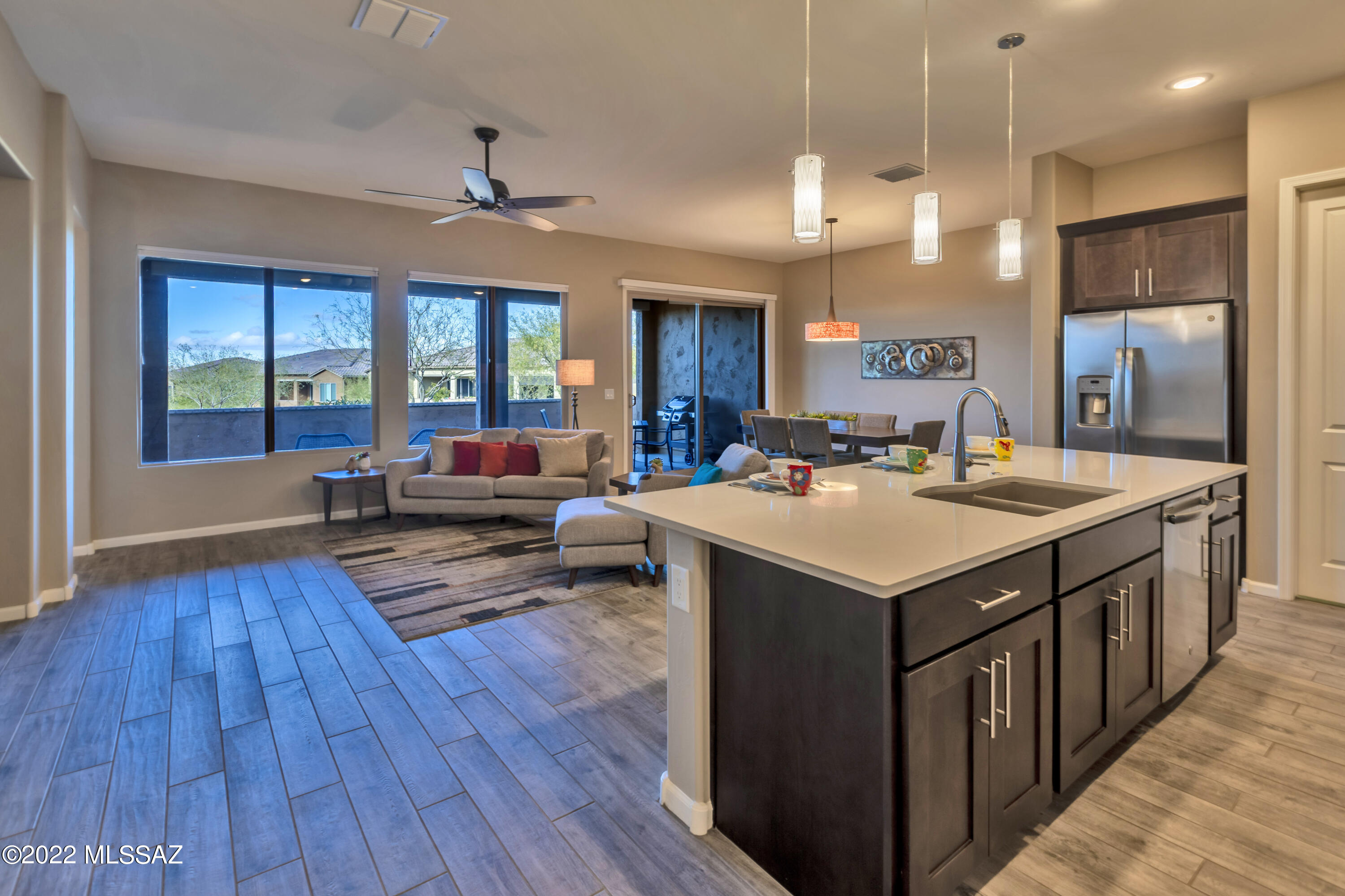 Beauty, charm, and a prime location highlight this wonderful villa. Step inside and you will be captivated by the open and airy spaces throughout. This Viva model, completed in 2019, is 3 years young and meticulously maintained. Upgrades throughout include, cabinets, counter tops, designer backsplash, SS appliances, and tile floors. Laundry room cabinets provide additional storage and the linen cabinet off the Owner's suite is a dream. The spacious den is perfect for your home office or library. Split floor plan offers privacy for you and your guest(s). Leave the exterior maintenance and yard work to the HOA and begin enjoying all SaddleBrooke Ranch has to offer the moment you arrive at your home. Covered back patio faces the arroyo and provides privacy when desired. Must see!