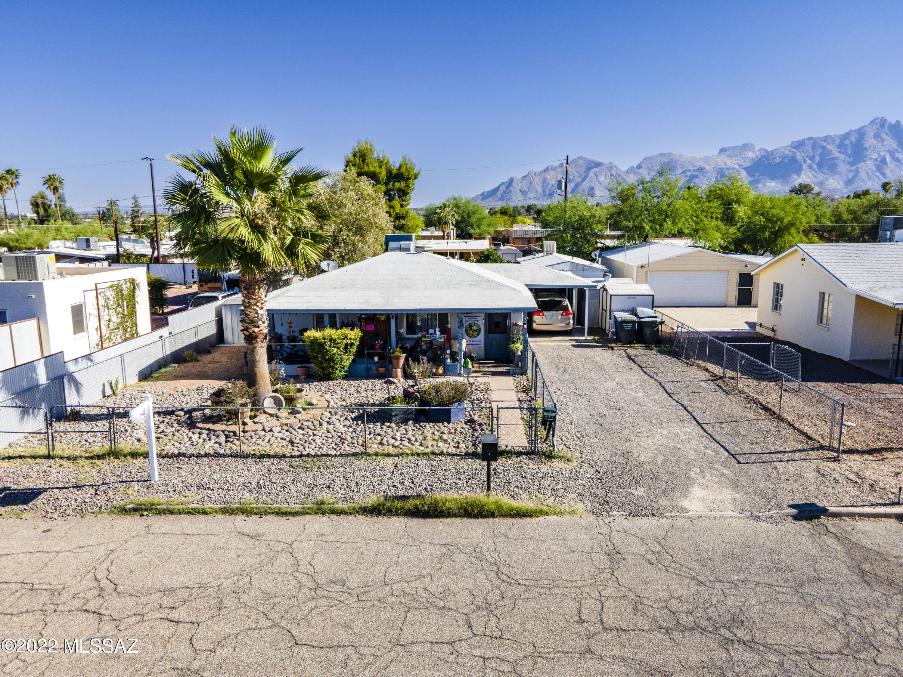 Looking for a house with guest house or a home with rental income? You've just found it! This charming single-level 2bed 1 bth home PLUS a 1-bedroom 1 bath guest house showcasing carport parking, desert landscape, and a cozy front patio is the one! Great location close to restaurants, shopping spots, schools, and markets. Main house has brand new windows & doors, tile flooring, newer heating & Cooling & neutral palette throughout. Relax in shaded backyard with a lovely gazebo, shade trees, storage shed, & plenty of space for entertaining and customizing to your liking! GUEST HOUSE IS SEPARATELY  METERED (ELECTRIC) & HAS  TANKLESS WATER HEATER & includes own private yard, separate entrance, laundry, & workshop . You don't want to miss this  opportunity! Call to schedule a visit today.