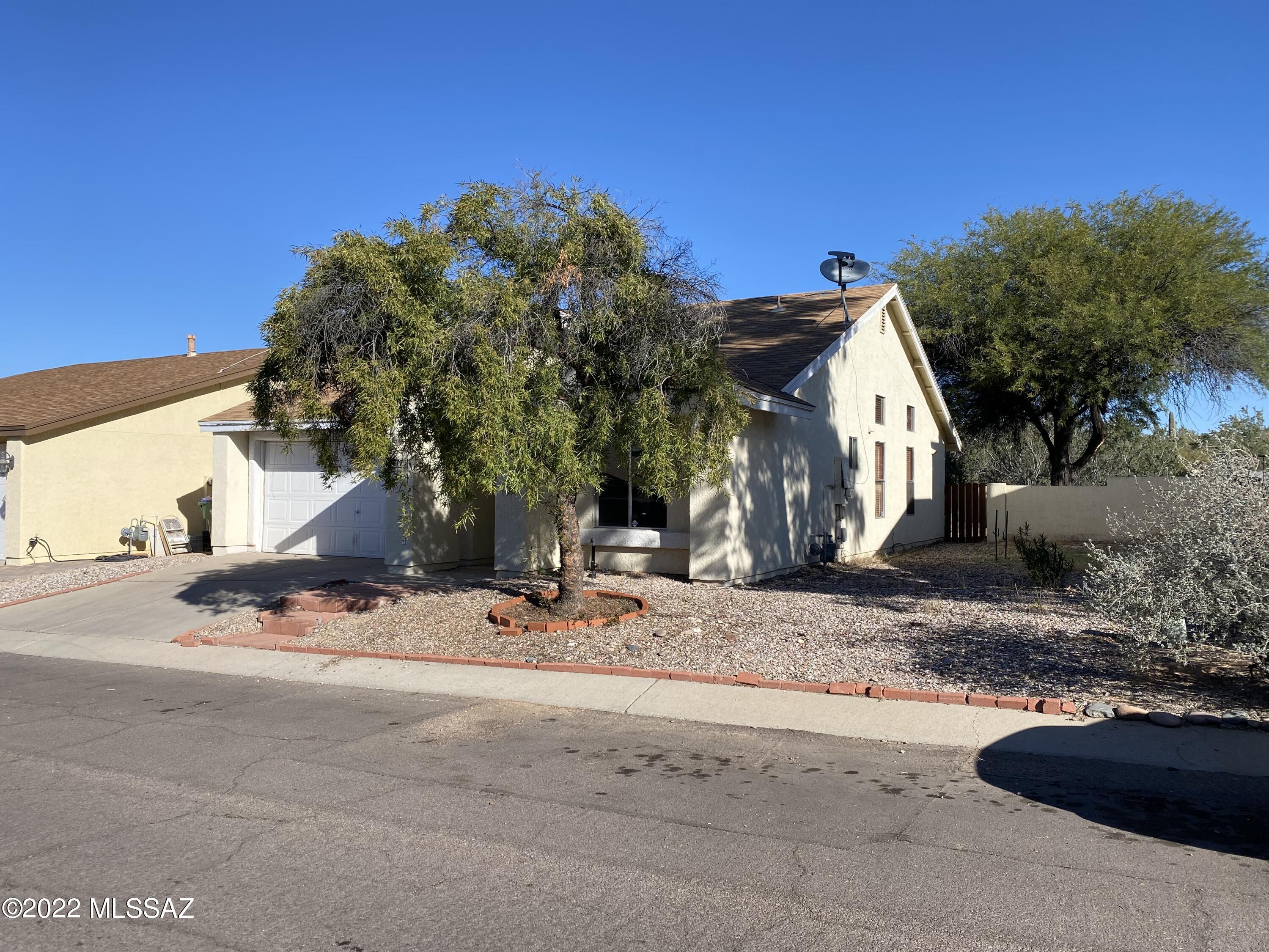 2 bed, 2 bath home that backs up to open desert.  Split bedroom plan with a bedroom and full bathroom near entrance to home.  The living area is situated in the middle of the home leading to the dining area, kitchen, and primary bedroom with walk-in closet and bathroom.  Laundry room leads into the 2 car garage.