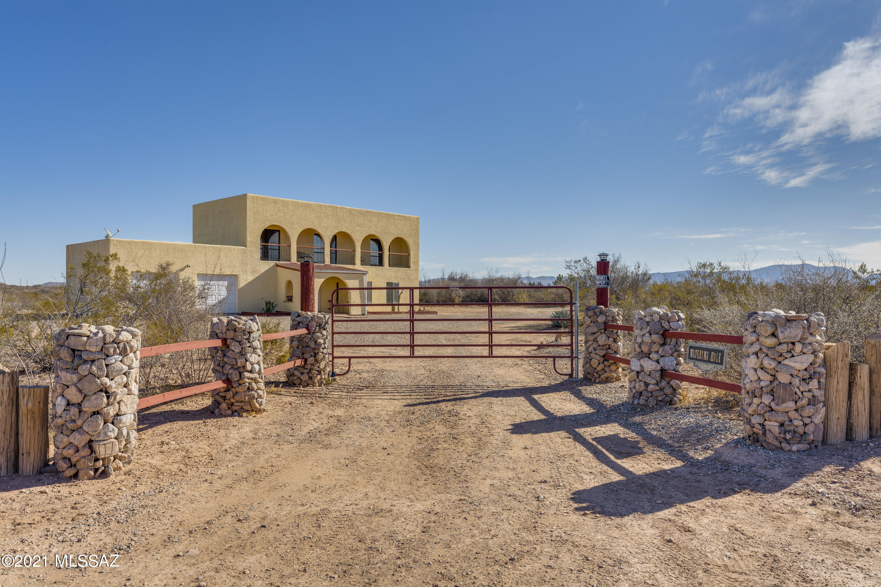 Spectacular Country Estate! Proudly presenting this beautiful home nestled on 12.9 private acres with panoramic mountain views. This custom home features 4 bedrooms, 3 full bathrooms, oversized 2.5 car garage (that will fit your truck), full RV hookup, open living/dining, loads of storage, and a massive bonus room that can easily be converted to a 5th bedroom or 2nd downstairs master ensuite. You will love those morning sunrises on the back patio and evening sunsets on the expansive balcony. Need space for your animals to roam...or looking to build the shop of your dreams...or maybe you just want to enjoy the peaceful, natural desert surroundings and dark skies that Southern AZ is known for...this property has something special for everyone. Call today for your personal tour!