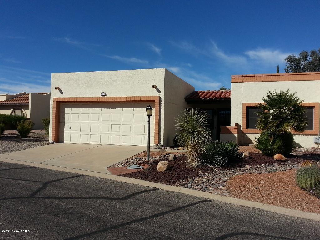 Solid home with peek-a-boo front mountain views enjoyed from the kitchen nook, front bedroom and side patio area. This is ready for your new flooring & updating if and as you wish. Light & bright floor plan with a L-shaped living/dining room, breakfast nook in kitchen, cozy glassed-in Arizona room, ceiling fans everywhere and a big back yard with pavers delineating two places to set your patio tables. Bryant HVAC system, new water heater, refrigerator & dryer installed 2015. Other appls & plumbing fixtures updated over the years. Transferable termite warranty and Cooling & Heating contract. All this plus 2.5 car garage. Use additional half garage for golf cart as originally built or the workshop that's in there now. Selling As-Is. Great property!
