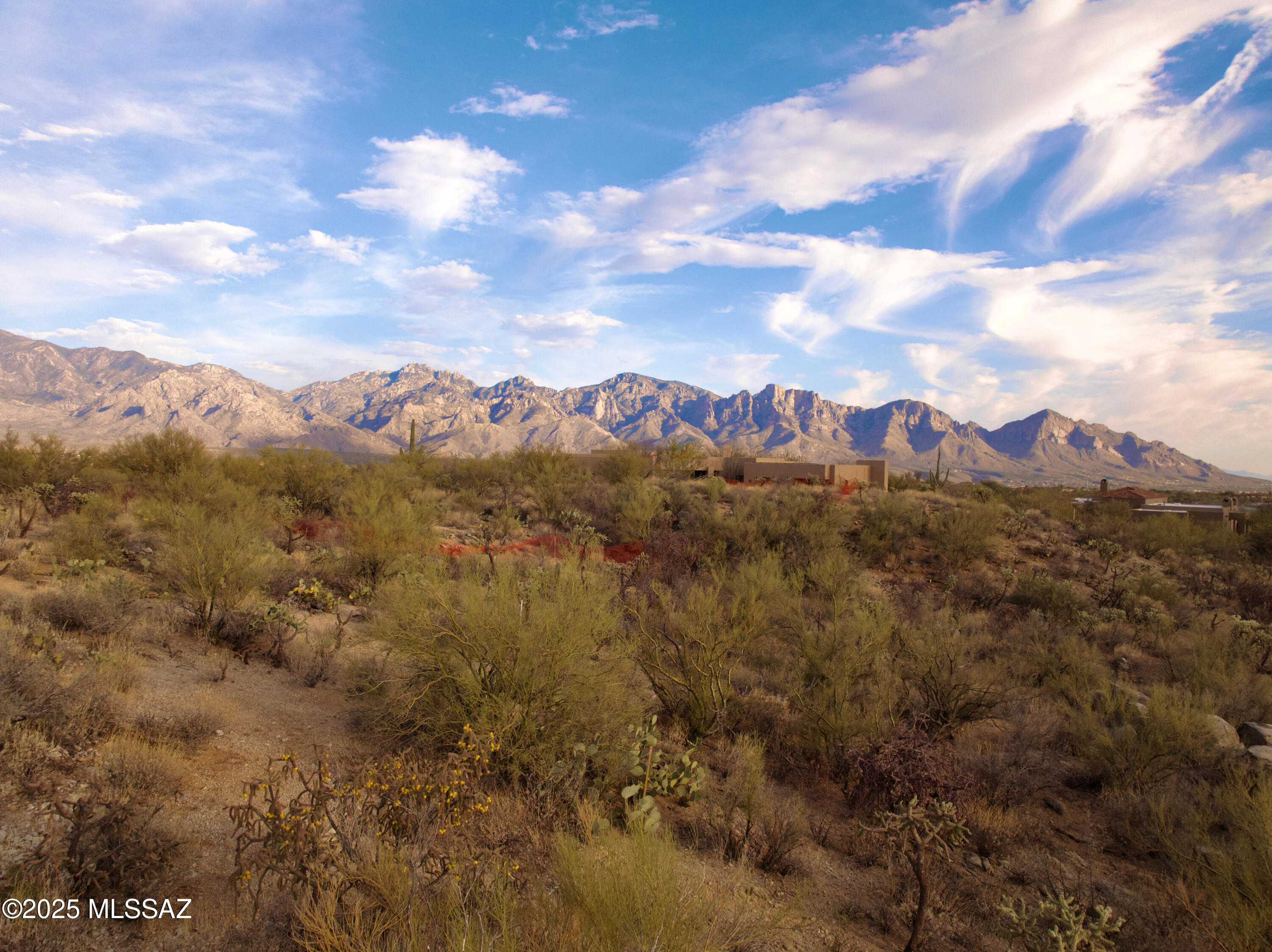 Unparalleled Views from This Premier Oro Valley Homesite. Perched atop a prime, sloping homesite, this 1-acre gem offers breathtaking, unobstructed views in every direction, including Pusch Ridge, the Tortolita Mountains, Honey Bee Canyon, to enjoy remarkable sunrises to twinkling city lights at night. Perfectly positioned on the highly desirable west side of Quiet Rain Dr., this elevated lot provides the ideal canvas for a home designed to maximize its stunning all- encompassing surroundings. Located in a prestigious, well-maintained Oro Valley
community with multi-million-dollar estates, this property combines exclusivity with convenience. Just minutes from top-tier restaurants, golf courses, hiking trails, medical facilities, and more, it offers both tranquility and accessibility. If you're searching for the best lot ..... This is It!!