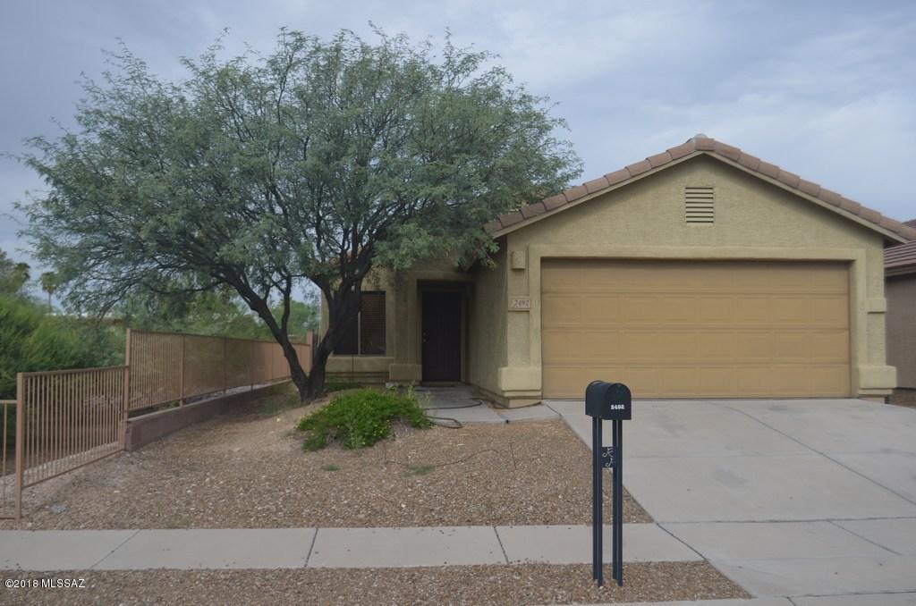 Look at this  3 bedroom, 2 bath, formal living room with large front window, Great room with all appliances, center island in the kitchen, & cozy family room good size master with private bath, laundry room, 2 car garage, large yard with covered patio.