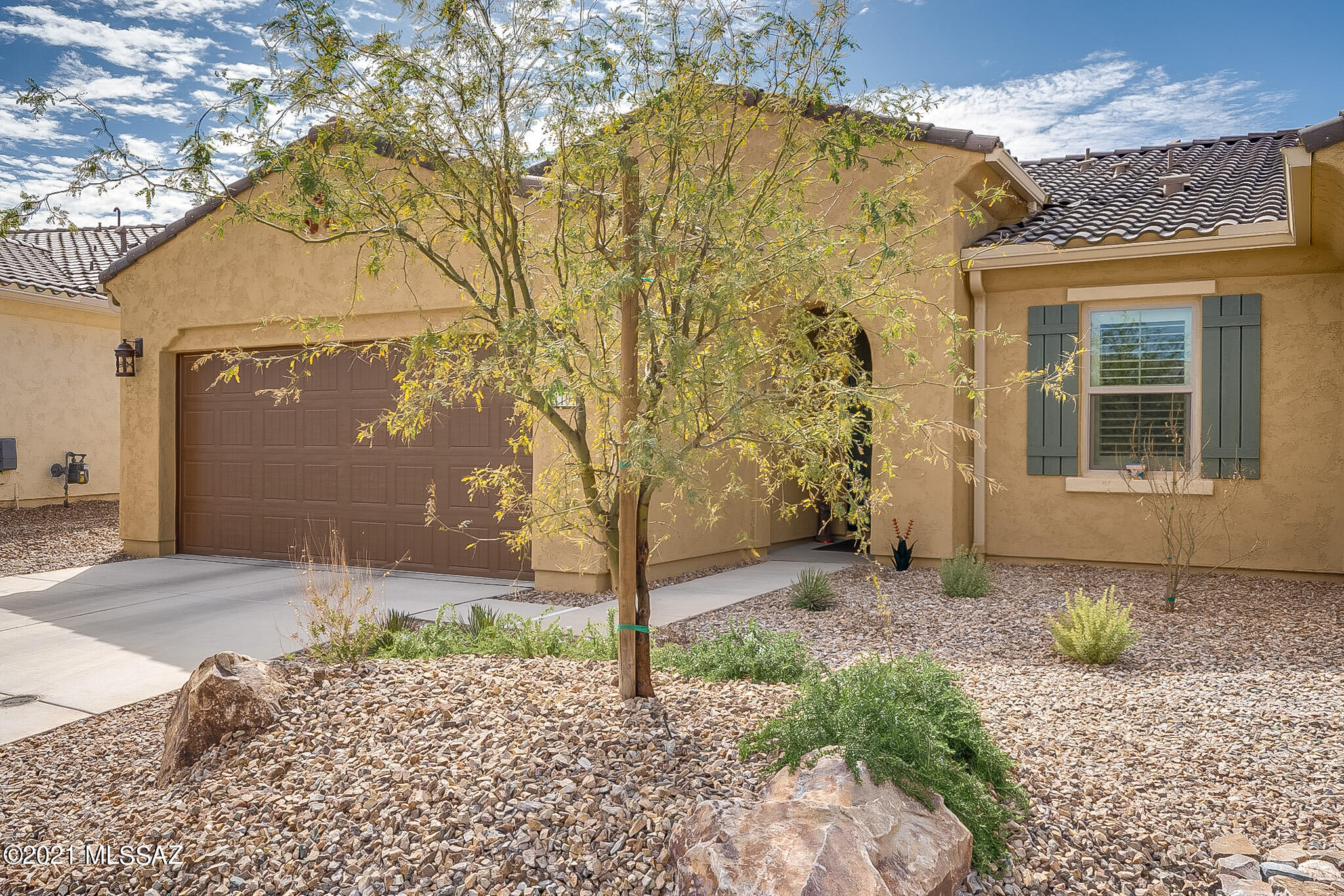 ENJOY THE BEST OF LOCK AND LEAVE LIVING!  This 2 year old Sagebrush has been meticulously maintained!!  With a walled rear courtyard and a quiet location, it is the perfect retreat for a part-time or full-time residents.  This pristine 2 bedroom, 2 bath home is light and bright with a walled courtyard for added privacy -- perfect for pets!   Interior upgrades include granite countertops, gas range, Blanco undermount sink, Shaker-style Beech wood cabinets, upgraded light fixtures, six panel doors, Plantation shutters and NO CARPET!   With a huge bar for entertaining and an open concept great room, dining and kitchen and a walled courtyard, this compact Villa is the perfect get-away!   There is little to do but move in and enjoy the lovely neighborhood, community and amenities.