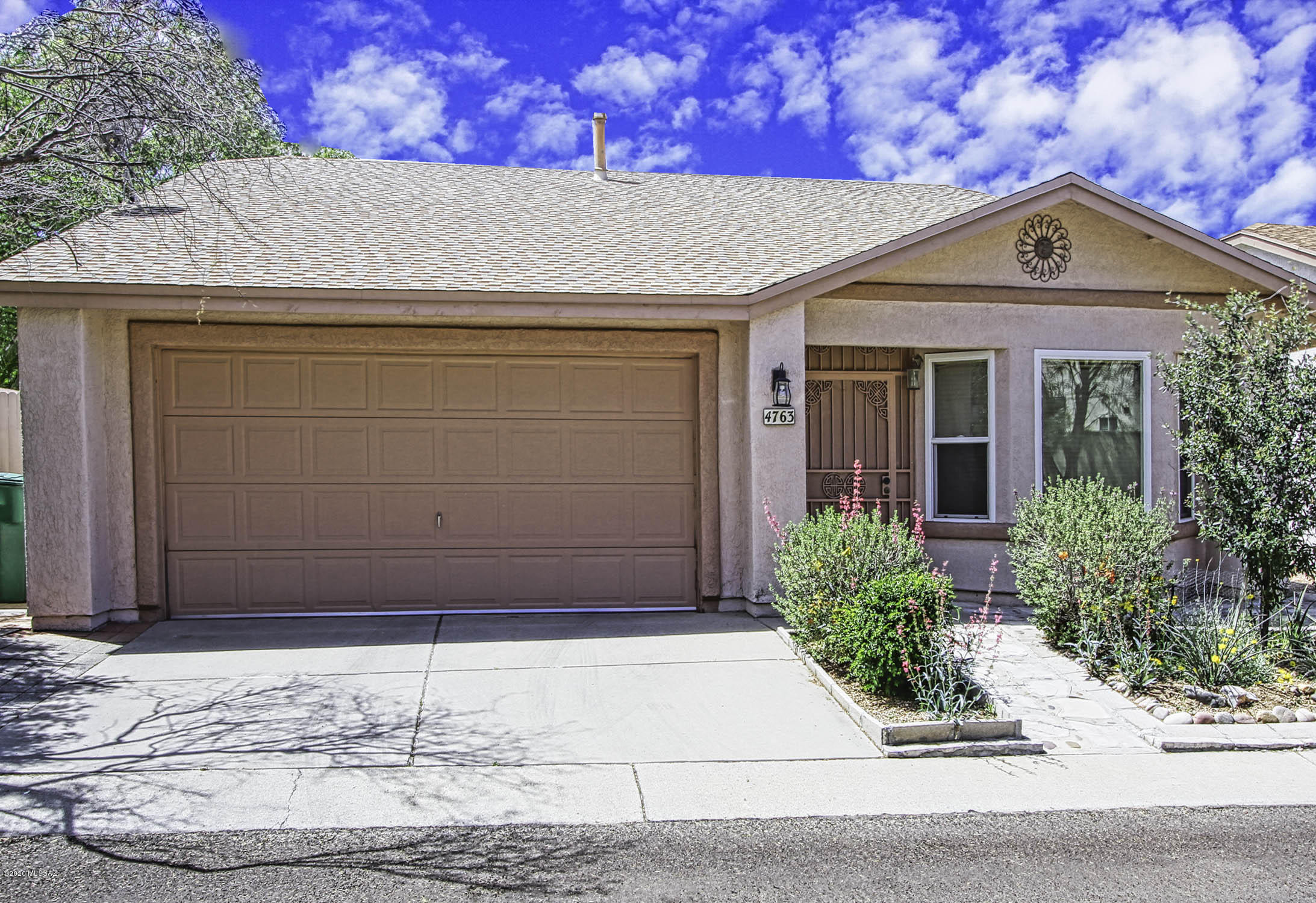 Immaculately maintained original owner home with tons of upgrades. High ceilings, gorgeous 20'' tile in all main areas, upgraded dual pane doors & windows, deco plant shelves & more! Nice foyer opens into huge great room & sep dining area. Completely remodeled kitchen w/custom maple cabinetry, beautiful granite w/backsplash, smooth top range & extended breakfast bar. Huge master suite w/walk-in closet, upgraded shutters & remodeled bath w/lg tiled walk-in shower. Upgraded guest bath & bedroom was extended for extra space. Private yard w/ext covered patio, mature vegetation for extra shade & conv side area for yard tools, pots & more. Water heater & Poly Plumbing completely replaced in 2014, New roof 2014, New hvac 2010, ext & wall painted 2014 & extra blown-in insulation too. A rare find!