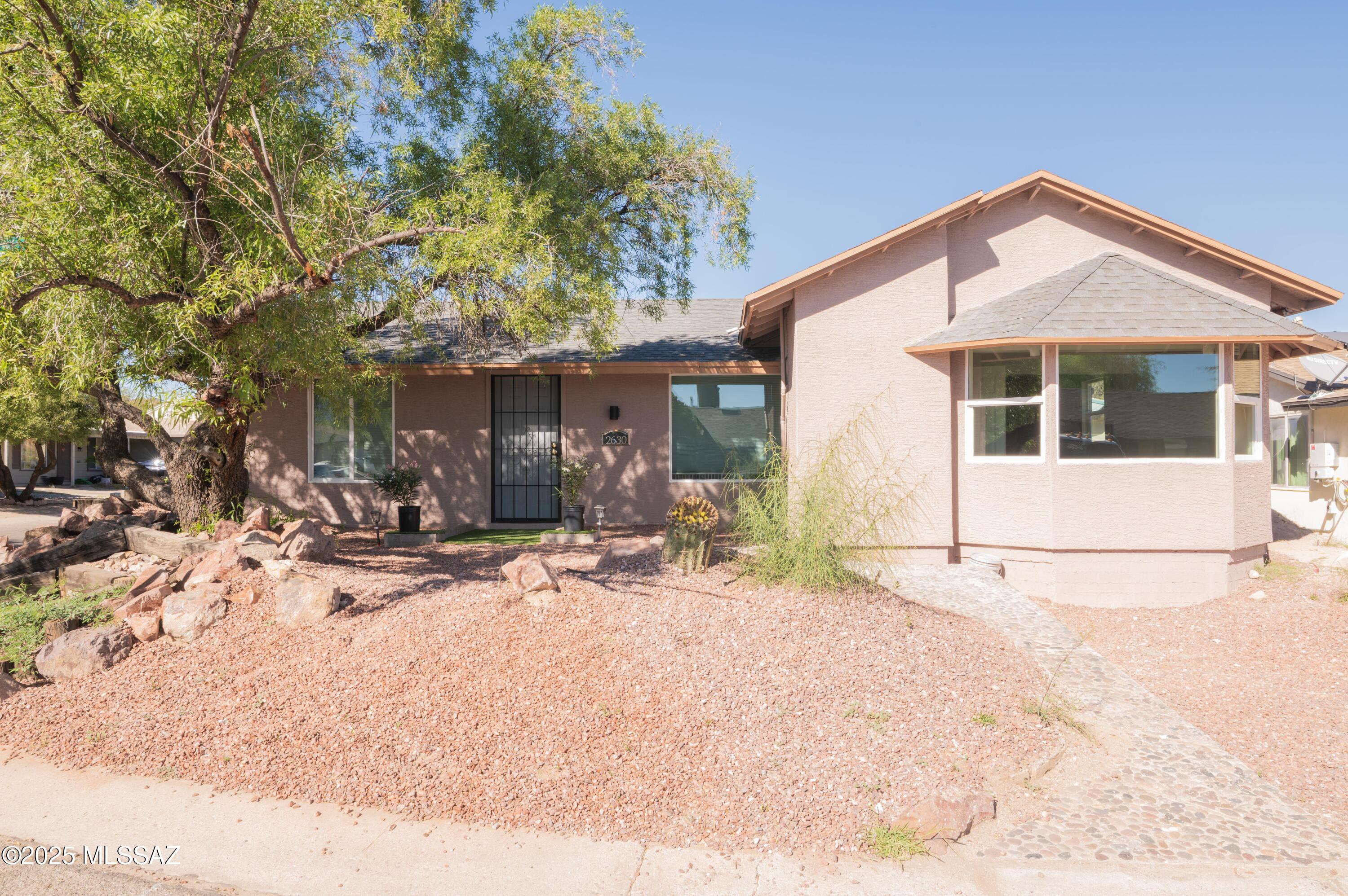 Beautifully remodeled 3 bedroom, 2 bathroom home. Kitchen boasts granite counter tops and a prep sink with a waterfall feature. New AC, new gas water heater, new appliances, new shingles on roof. 
Spacious backyard on a corner lot.