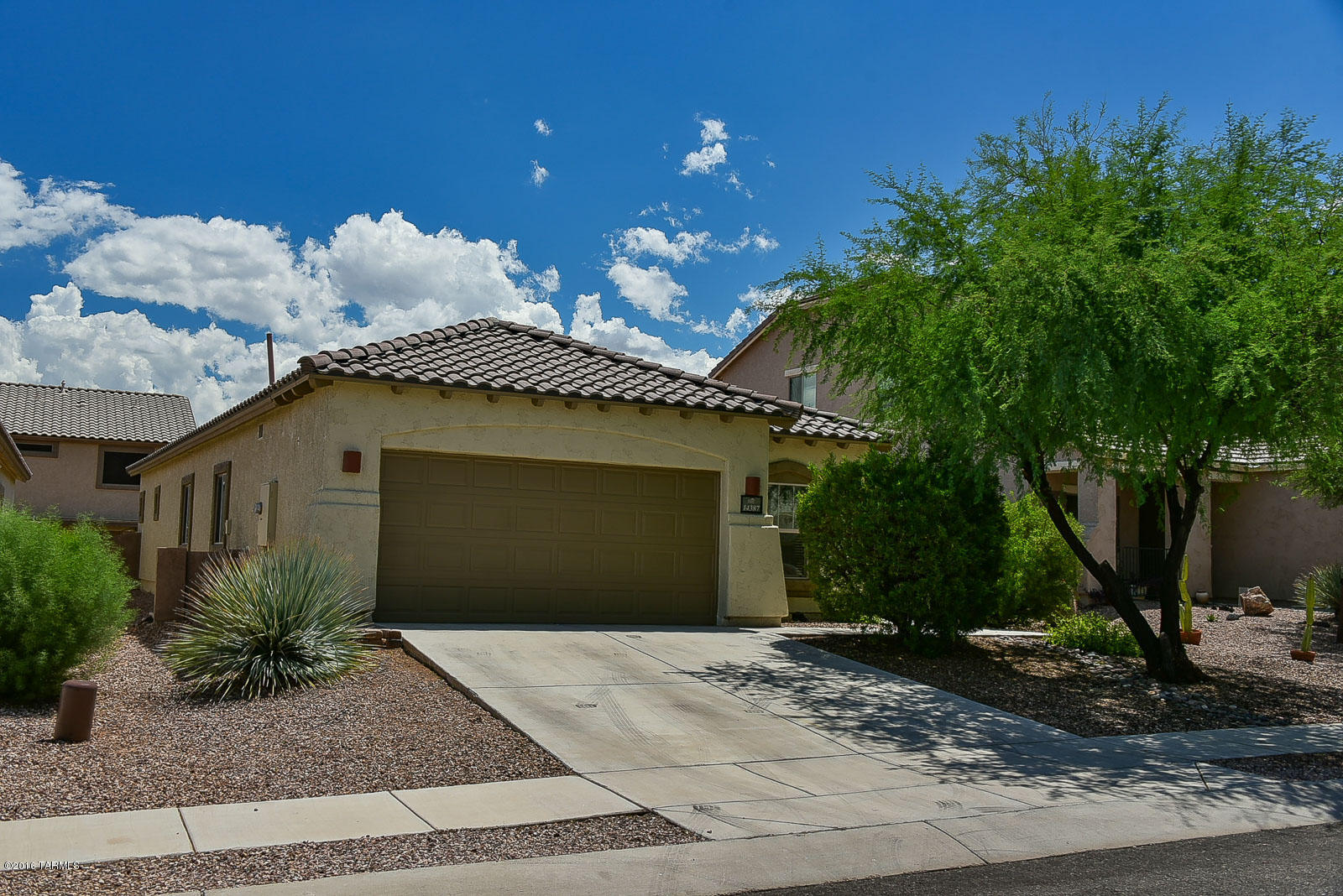 Immaculate throughout and ready to move in today! Beautiful home in fantastic condition with a very popular floor plan. Huge kitchen with lots of cabinets, island, and breakfast area. Bright and open. Several ceiling fans. Beautiful ceramic tile and neutral carpet throughout. Big rooms. Great backyard with covered patio, extended patio with sitting area, bench and planters, citrus tree, artificial grass, and bougainvillea. Incredible community with 3 pools, splash park, 9 parks, trails and paths for walking and cycling, lakes, and the recreation/fitness center.