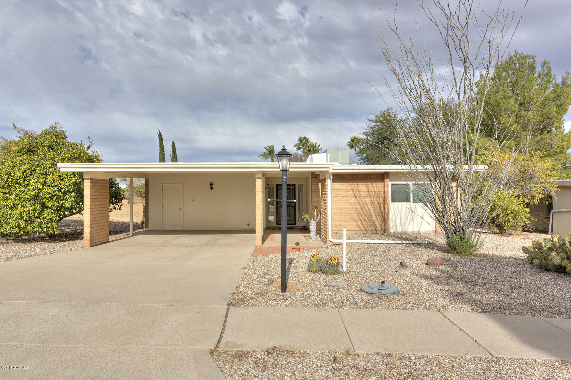 Seller has completed the big work.Roof replaced 1997,all wood facia replaced 2014,new front and back porches 2014, new taller toilets...price is a great value so you can make this home your own...but it is mostly the easy fun stuff,,,flooring, counters,,,make if your own. NO GVR...but it is available. Great size yard with 3 citrus trees and the rest is easy care. This home is ready for you to make it just what you are looking for.