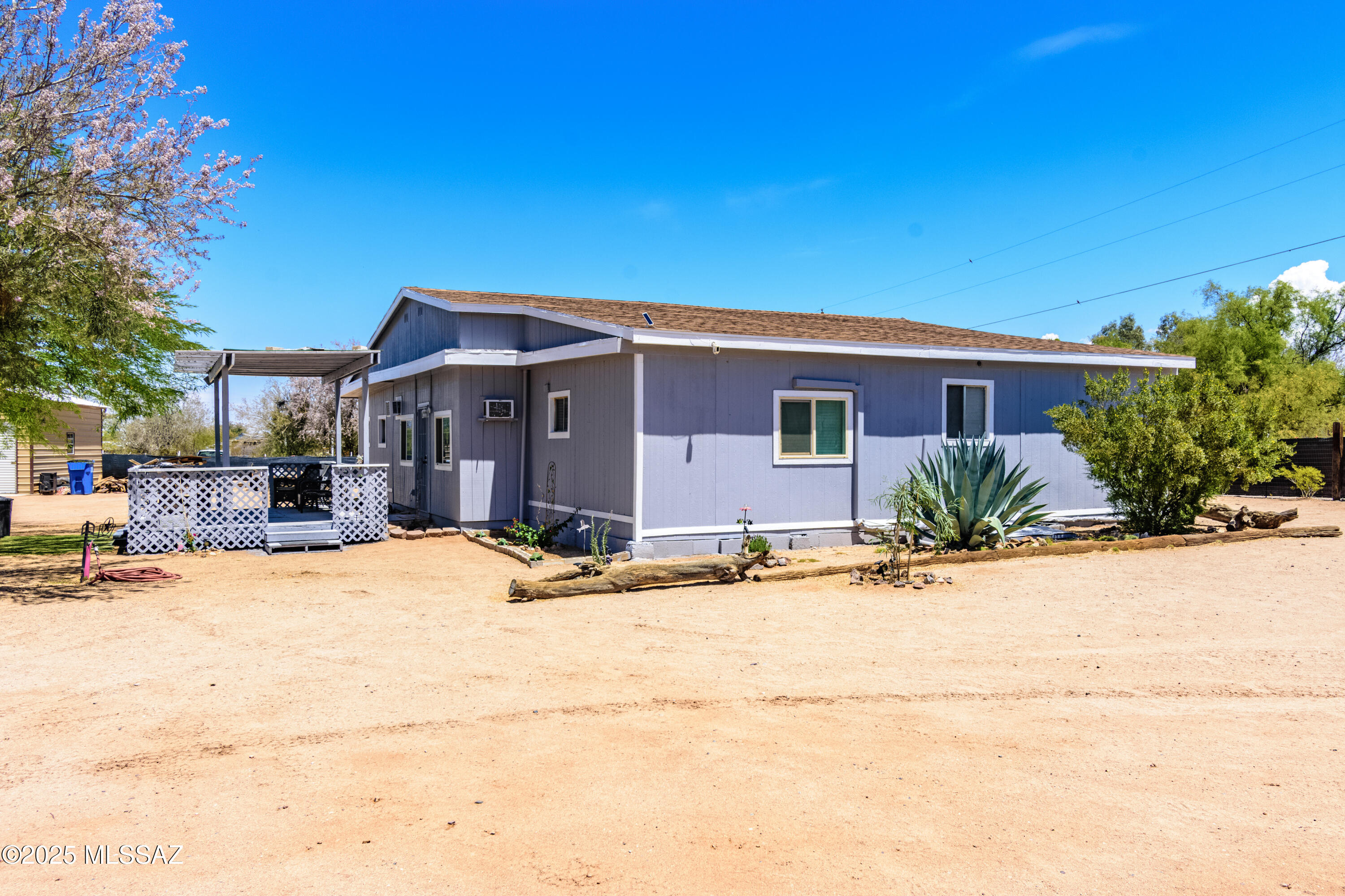 SFR! Welcome Home—where space, freedom, and functionality come together in one unique property. This freshly painted 5-bedroom, 2-bath home sits on a spacious lot in a quiet, no-HOA neighborhood with a new roof, wide-open yard, and plenty of room to live, work, and create.

The standout features? A massive 2-bay garage/shop ready for serious projects, plus a huge storage shed with a nearby pedestal already in place—making it easy to convert into a fully powered office, studio, or workshop. Whether you're a hobbyist, remote worker, or need space for a small business, this property offers flexibility and room to grow.

Inside, enjoy versatile living areas and a smart layout that fits a variety of lifestyles. Outside, the open land gives you the freedom to expand, garden, park equipme or just enjoy the peaceful desert surroundings.

No HOA, just opportunity. Don't miss your chance to own this truly functional, future-ready home.