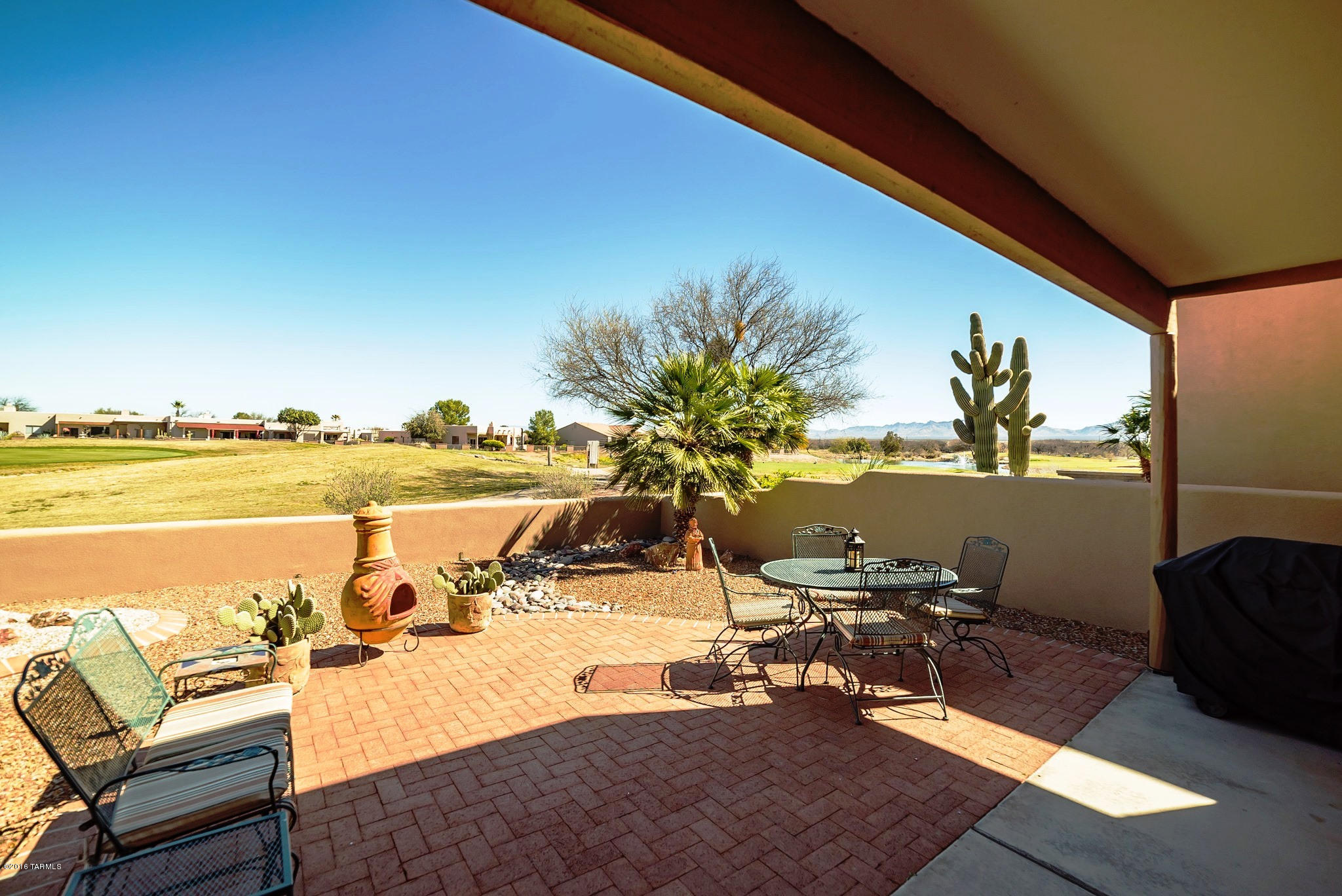 Looking for a great winter hide-a-way? Look no further - Southwest colors make this a special home that is ready for year round living or your winter retreat. Beautiful tile floors throughout except the bedrooms. Open floor plan 2BR, 2BA, 1.5 Car Garage. You will enjoy spending time on the back patio which provides great views of the Santa Rita Mountains and Torres Blancas Golf Course 11th Hole and Water Feature! No fuss, natural desert landscape. Located in the gated community of the Springs, it is within walking distance of the Santa Rita Spring Recreation Center; and area walking trails and community parks.