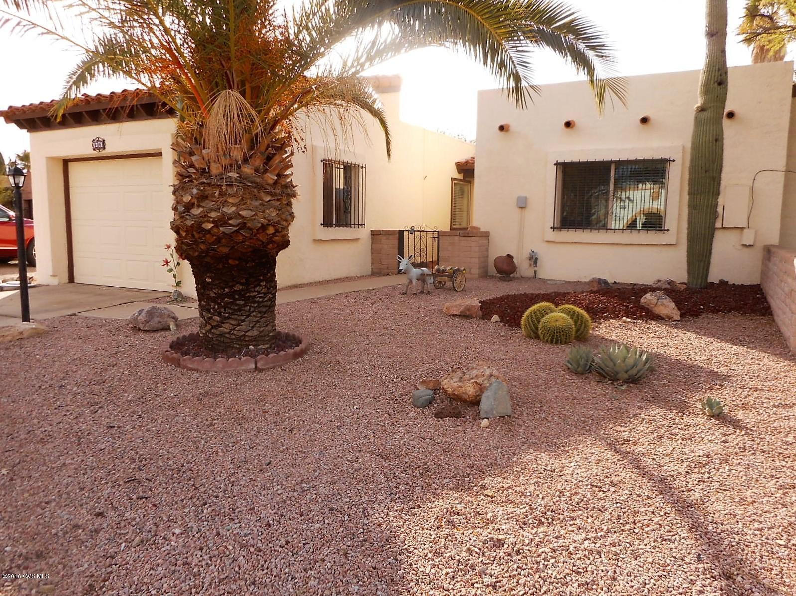 Welcome to a beautiful territorial townhome! This comfy, extremely well maintained residence sits high on a corner lot with nice views of the Mtns. You'll love the serene, quiet location, close to golf courses and Green Valley Rec Centers; then, step inside and you'll be delighted by all the natural light emanating from the new vinyl windows and sliding glass door to your very private back patio. The spacious MBRM with large walk-in closet has room for a comfy reading area, and the kitchen features newer countertops/appliances and a secluded eating area for your early morning coffee. The large 2nd BDRM easily functions as either a bedroom for guests or a den, and you're sure to stay comfortably warm or cool with the new HVAC system, installed in 2011. Nice Home: Excellent value!!