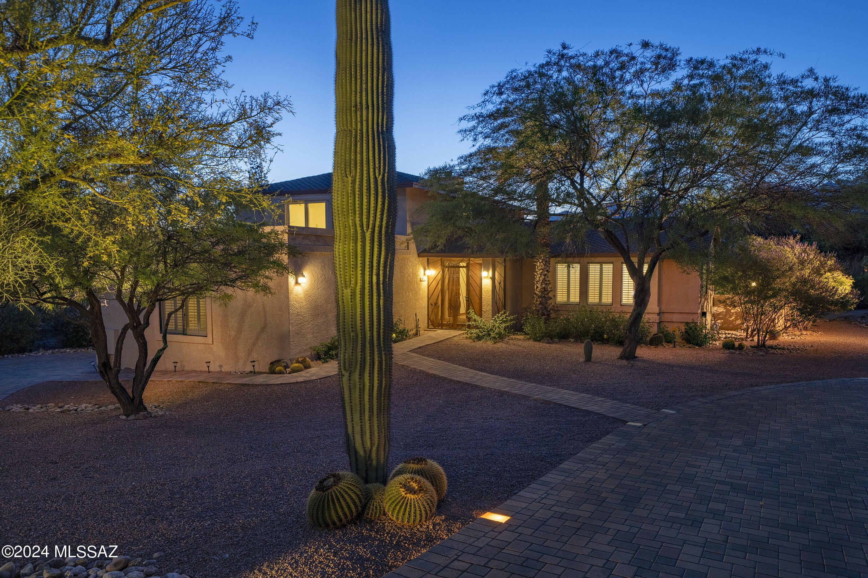 Privacy and Mountain Views Embraced by the Pristine Desert Landscape of the Northeast Foothills.  Tastefully Updated, Move-in Ready, Fresh Paint and New Carpet.  Contemporary Floor Plan, Wood Floors, Vaulted Ceiling and Lots of Natural Light.  Plantation Shutters Throughout.   Family Room with Gas Fireplace opens to a Spacious Patio & Deck.  Separate Living & Dining Rooms for more Formal Entertaining.  Easy Family Living and Lots of Possibilities with this Clever Split Level Design, Light, Bright and Open.  Beautifully Landscaped Front Elevation.  Catalina Del Sol is a Charming Neighborhood of Custom Homes on Large, Gracious Lots, Close to Everything, Yet Away From It All.  You'll love living here!