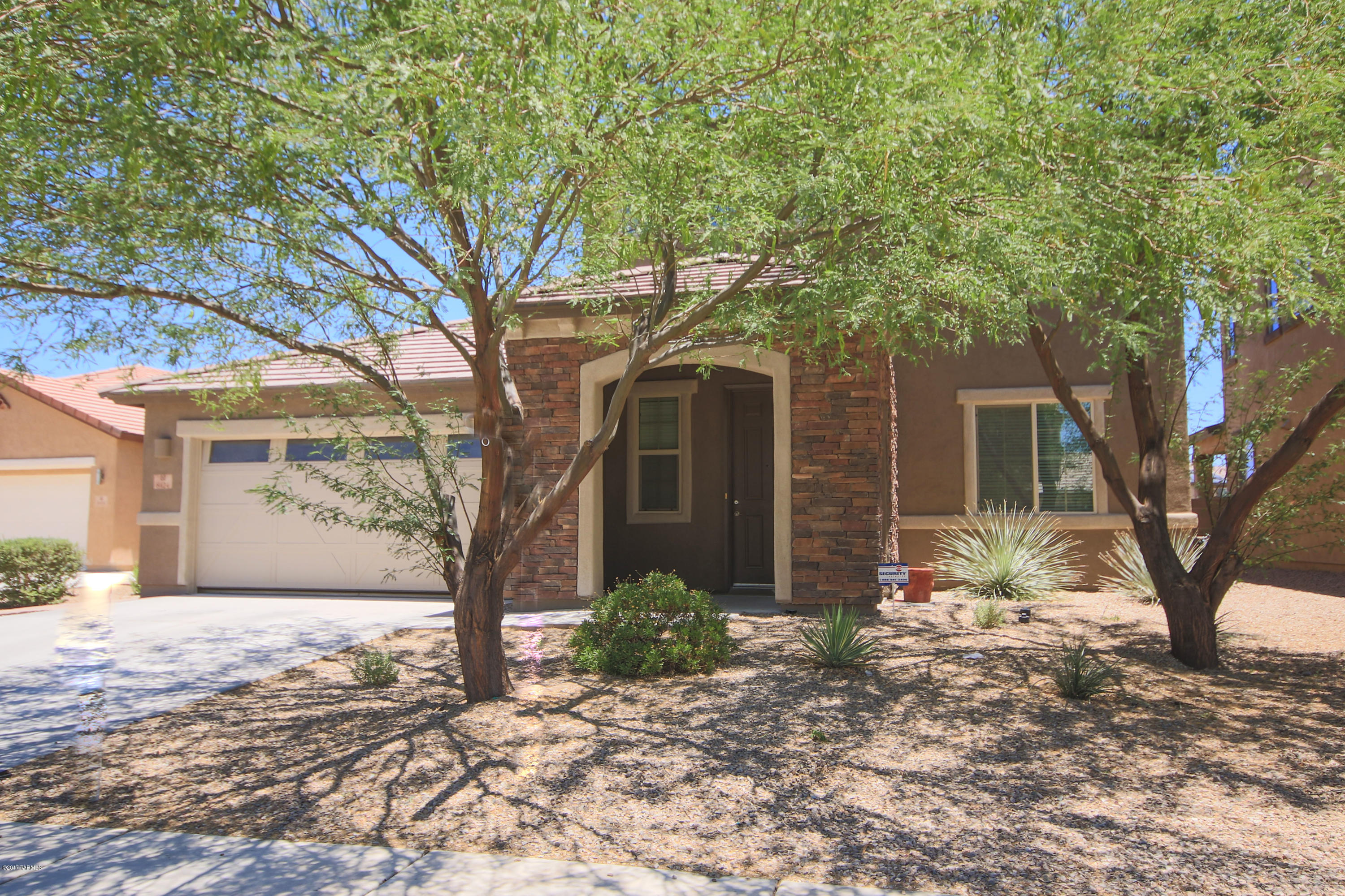 This Richmond American beauty shines throughout. Meticulously maintained 3 Bedroom plus Den. The kitchen is well appointed with granite counters, SS appliances, beautiful cabinets and a large pantry. This home is freshly painted with new neutral looking carpet, custom ceiling fans and ceramic tile. There is new expoy flooring in the garage that gives it a clean look. Also, there is a large spacious landscaped backyard with a covered patio and brick pavers. Super convenient to everything Marana has to offer. Community parks, shopping, easy access to I-10, hiking trails and more.
