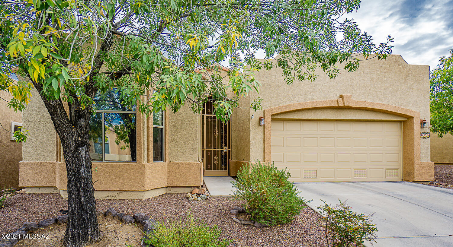 All the upgrades have been made for you! This light and bright home has granite on all counters, white kitchen cabinets, plank tile in all living areas; laminate in bedrooms, extra storage in garage and a very large screened-in back patio to enjoy the serene park and birds. Las Campanas Village offers many more amenities than most neighborhoods. Your monthly HOA fees cover: a blanket ins. policy, maintenance of front and back irrigation and landscape, exterior paint and stucco, roof, street, gate, common area and park, pest control and basic cable. This allows you a more ''lock and leave'' scenario or just gives you more freedom. This gated community (open during the day) also has a walking path around the neighborhood and the cental park. Close to shopping, restaurants and other amenities