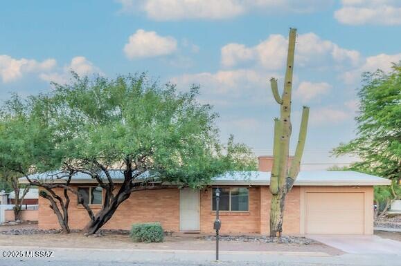 Enjoy Tucson living in this move-in ready 2 BD/2 BA home on a corner lot with mountain and city views! Includes 1-car garage plus a 243 sq ft utility room—perfect for an office, workshop, or gym. Interior offers dual-pane windows, tile, and carpet flooring. No HOA, large yard, covered patio, and energy-saving  solar. Prime location near Interstate 10, downtown Tucson, University of Arizona, Pima College, golf, The Loop trail, ''A'' Mountain, and Tumamoc Hill. Ideal for a starter home or an income-producing opportunity. Schedule your tour today!