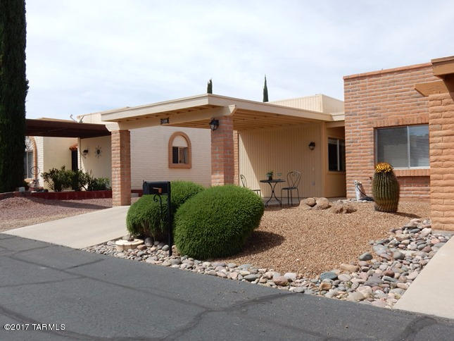 Beautiful & bright two bedroom, two bath end unit townhome with privacy & front mountain & desert views. Nicely fully furnished per inventory.  Great floor plan. Hunter Douglas window coverings throughout home & custom decorator cornices in living room & owner's suite. All appliances stay including stackable washer/dryer. Home features:four skylights, upgraded cabinetry, tile & Berber carpet with bullnose trim, ceiling fan & wall mirror in living room, more. Roof re-coated 4/17. Immaculate & move-in ready!