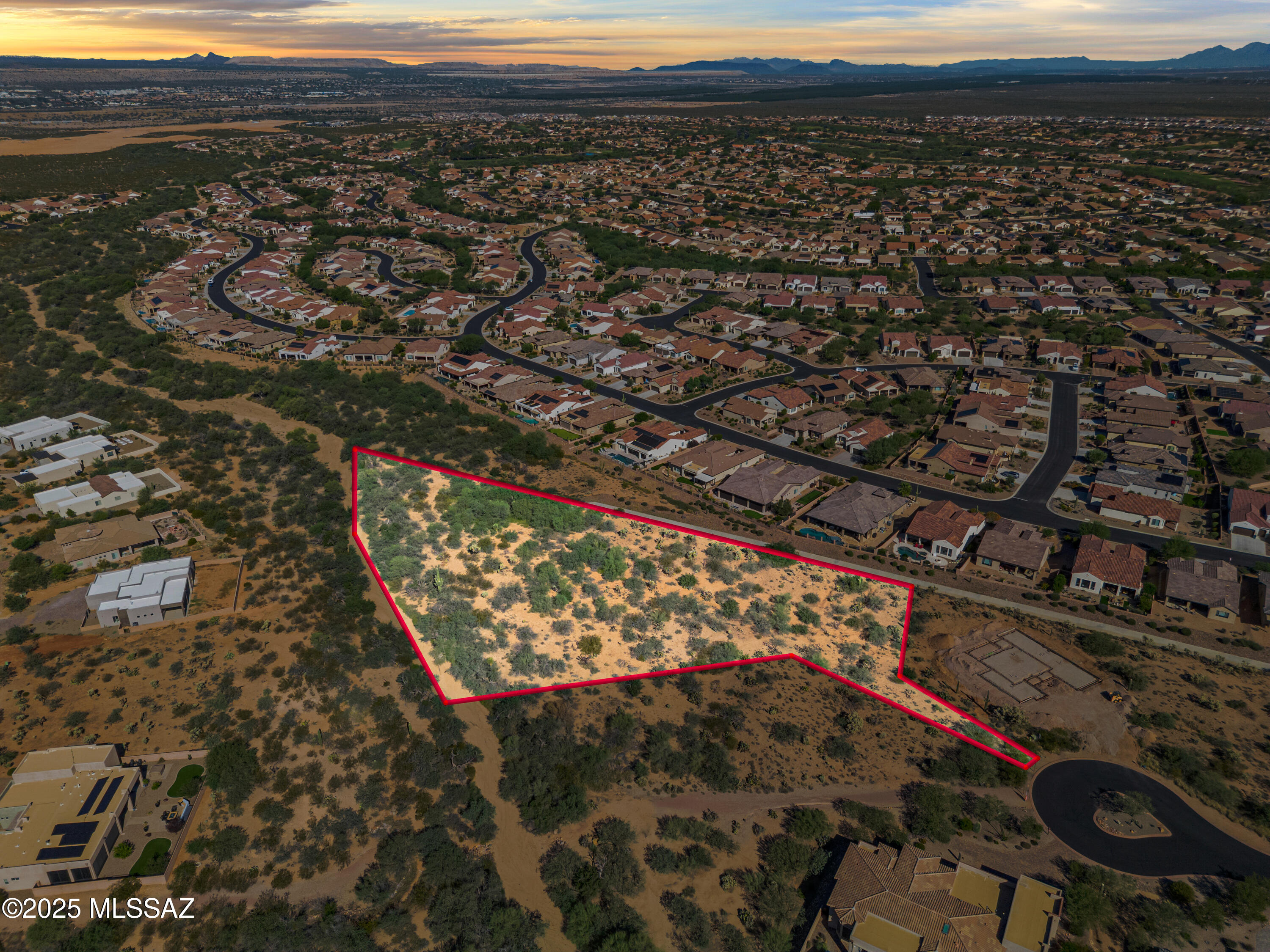 Set within the exclusive gates of Stone House, this rare oversized lot offers the perfect canvas for a one-of-a-kind custom home. Elevated above neighboring properties, the homesite is tucked back for true privacy while capturing wide, panoramic views that stretch from the Sierrita Mountains across the valley. Each evening, you'll have a front-row seat to Arizona's famous desert sunsets.

Stone House was carefully planned to blend luxury living with the natural desert landscape. Wildlife corridors, meandering washes, and walking trails weave throughout the community, giving it a serene and open feel. This cul-de-sac location provides both seclusion and security, with utilities already nearby. Bring your architect or builder and design the private retreat you've been waiting for in one of Southern Arizona's most sought-after neighborhoods. Buyer to verify all information deemed important to buyer.
