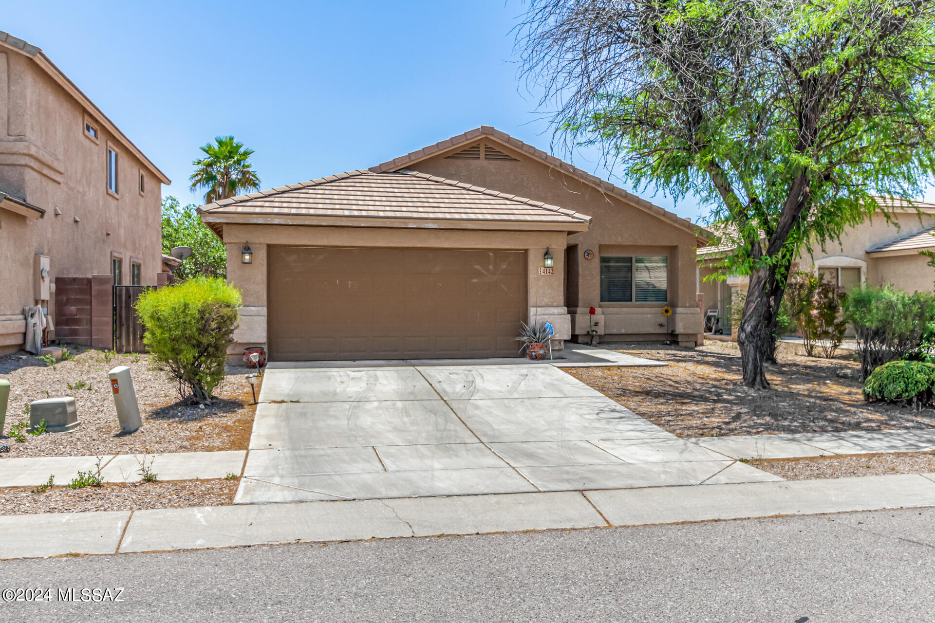 Welcome to this 4-bedroom, 2-bath residence in Valencia Reserve! The living room is highlighted by vaulted ceilings, a soothing palette, window blinds, and attractive wood-look flooring. The great room has sliding doors that open to the backyard for seamless indoor-outdoor living. The kitchen is equipped with ample wood cabinetry, SS appliances, a handy pantry, and a two-tier peninsula with a breakfast bar for casual dining. The main bedroom is complete with soft carpeting, a private bathroom with dual sinks, and a walk-in closet. Outside, the backyard offers a covered patio and paved ample space for hosting memorable gatherings.