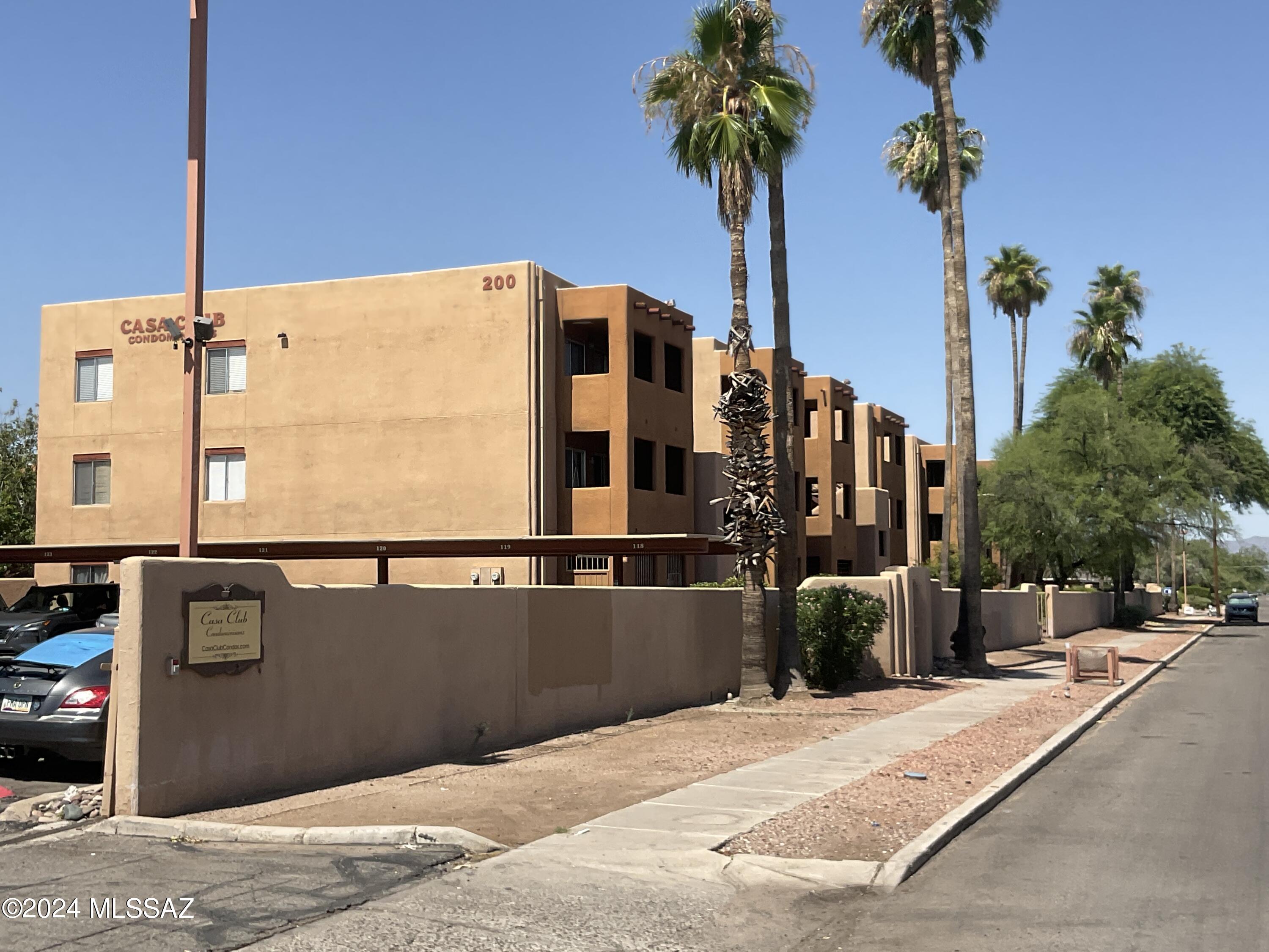 Introducing Casa Club Rental, a charming 1st floor condo with 2-bedrooms, 2-bathrooms located in the vibrant city of Tucson, AZ. This gated community offers a variety of amenities including a community pool, sand volleyball courts, and tennis courts for residents to enjoy. With convenient access to transportation and the nearby Mountain Bike Path, just 7 minutes away from the University of Arizona. outdoor enthusiasts will love the location of this home. The private patio with a storage closet is perfect for relaxing or entertaining guests. Inside, you'll find tile and wood vinyl flooring throughout the house. Located next to the pool/spa and tennis courts. Casa Club Rental is the ideal place to call home in Tucson.
