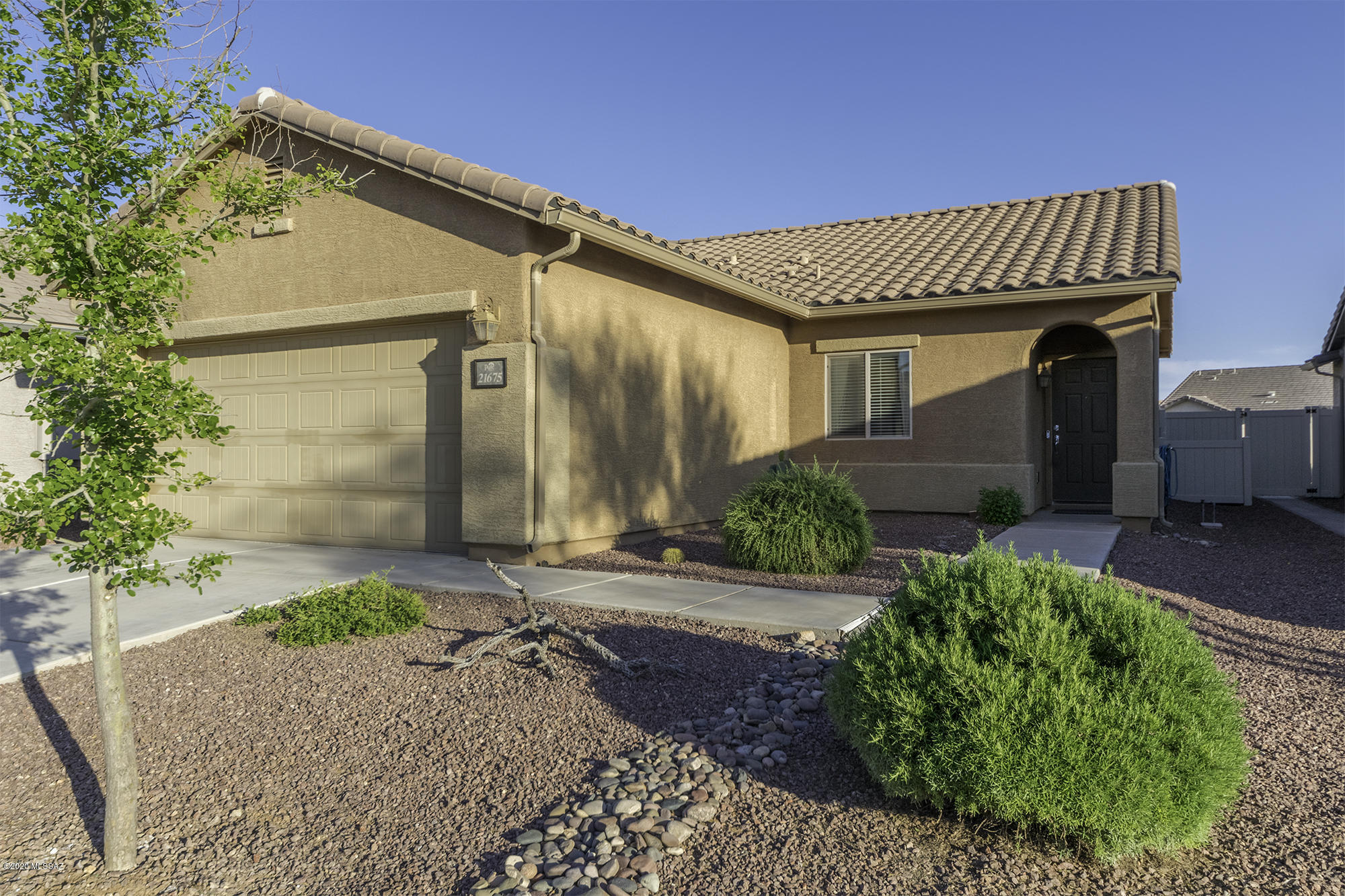 Pristine 3-bedroom with 2 full baths in family-friendly Red Rock Village. New wood tile in living areas and kitchen, $20,000 solar package included - no payments for buyer. Large, private, livable backyard. Automatic drip irrigation front and back. Community park - pool - play areas. 2 minutes to I-10. This home is move-in ready!