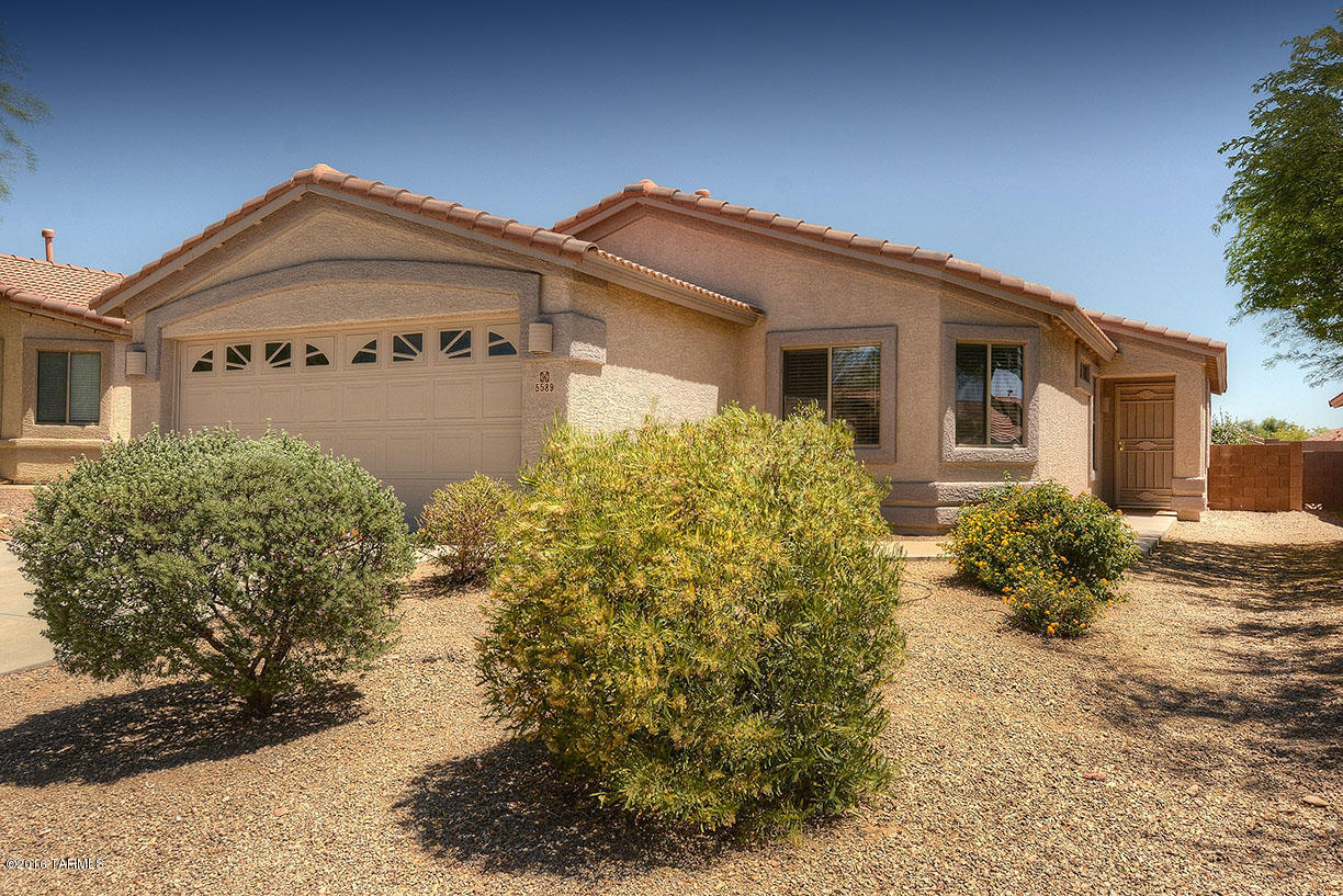 Totally MOVE-IN-READY 4BR/2BA home in popular Villages at Dove Mountain.4th BR has double doors & can also be Den/Office. Neutral Tile throughout except BRs, Brand New Carpet in all BRs! Just painted inside & out, new kitchen sink & faucet. Covered Patio off Great Room, easy care Backyard is completely fenced w/block wall. Walk to beautiful near-by park w/lighted Tennis Ct & Basketball Ct, enjoy walking/jogging trails and acres of open desert within the Dove Mtn Community. Grocery stores, restaurants, shops, gas stations, & three golf courses are minutes away, plus the world-class Ritz Carlton Resort is just up the road! A perfect family home, retirement home, winter visitor residence, or investment property.