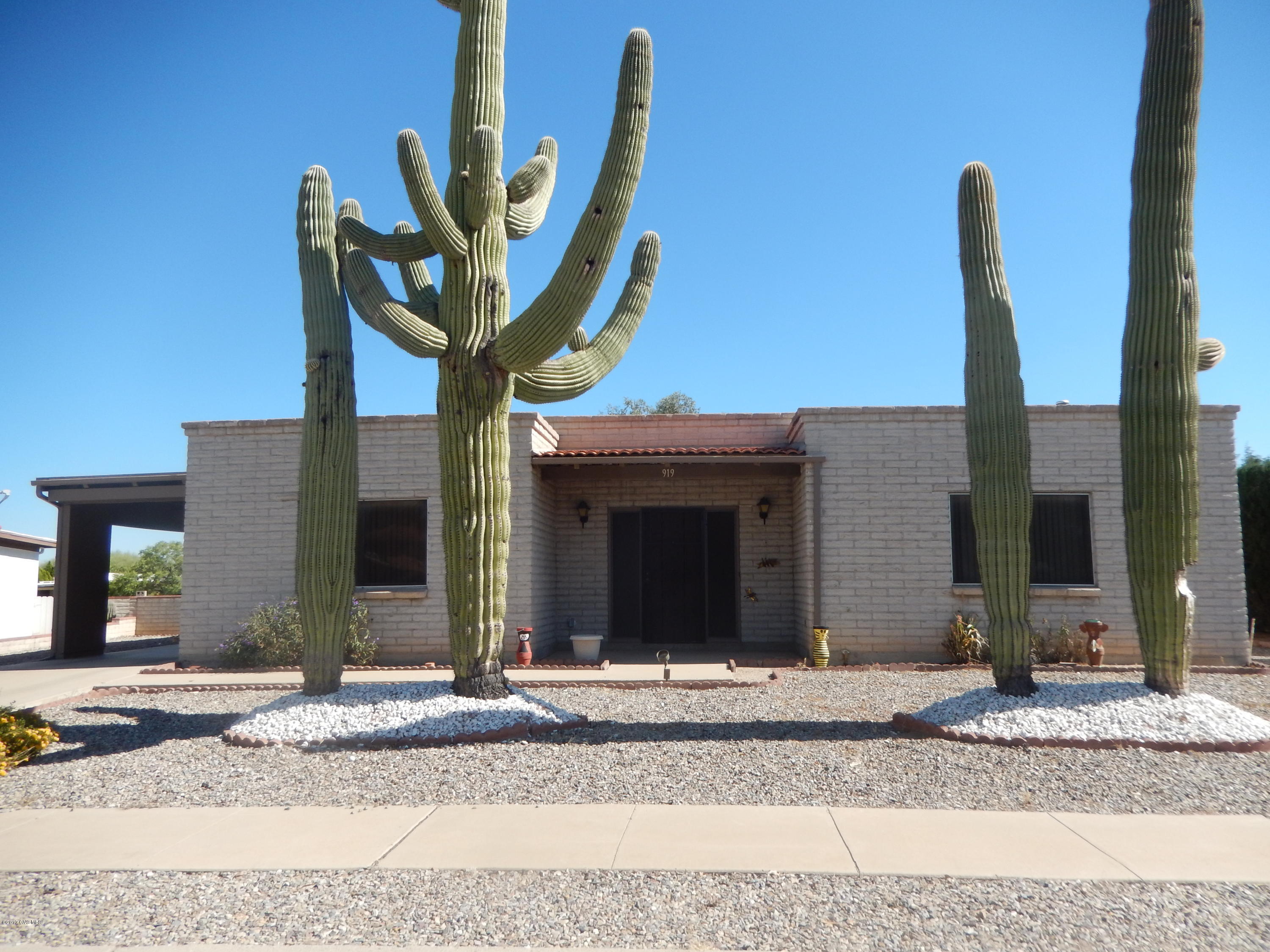 The 4 large saguaro cactus will welcome you to this 2BR/2BA ready to occupy home. Lovely tile floors and large laundry with storage. Open kitchen to living area. Kitchen has pull-outs, desk, and pantry. Private back patio with a peek of the mountains.