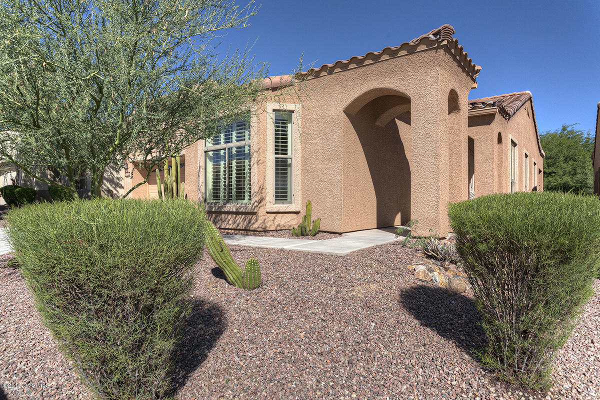 Absolutely Stunning describes this one. Step into the large foyer and you may be saying to yourself this is the one. The light and bright great room has tile floors, large Low E windows, high vaulted ceilings and designer paint. The split BR plan allows guests and owner plenty of privacy. The beautiful kitchen has light Corian counters and white appliances which set off the tall rich raised panel maple cabinets. A large kitchen peninsula has a breakfast bar for 4 and hides the sink and cook behind. Off the dining area which has a bay window is the King size Master BR w/ walk in closet and bay window providing a peaceful retreat. The master bath has a two sink executive height vanity and spacious EZ care cultured marble shower w/ a built in seat. All appliances stay including  the... ...washer and dryer which have their own room w/ storage and tall cabinets above. Walk out back to the beautiful covered patio that has been professionally extended with brick tumblers overlooking the lush green grass and trees in one of many community common areas. Enjoy many an hour relaxing with a book, visiting with neighbors or w/ a favorite refreshment. A den off the foyer makes a wonderful office or TV room. Plantation shutters on the windows is just another feature that wraps up this total package. |\n|The one of a kind HOA is set up much like a condo but w/ fee simple title. They maintain your landscaping, stucco, paint and roof. Also the water for your landscaping; monthly pest control; expanded basic cable TV; trash and recyclable pickup; fire, hazard and