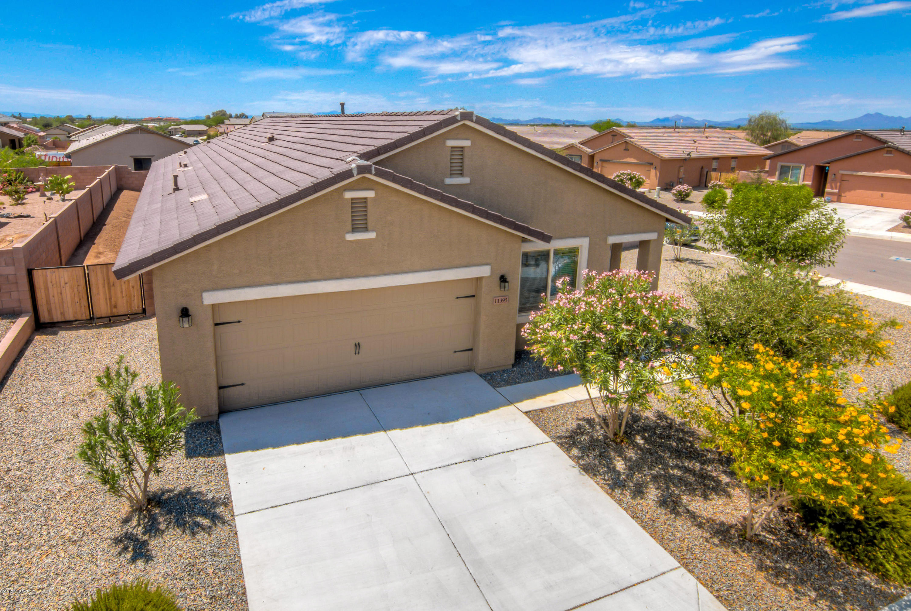 Nicely Upgraded San Lucas Home! 3 BR + Den home built in just 2014. Features corner lot, open floor plan with spacious Family Room, oversized ceramic tile, brand new neutral carpet, ceiling fans, full Laundry Room, double side-yard gate, and much more. Kitchen offers granite slab counters, rich wood cabinets, and coordinated appliances with gas cooking. Breakfast/Dining Area just off the Kitchen. Spacious Master Suite with walk-in closet and full private bathroom with garden tub. Backyard has covered patio, open main yard, and large side yard. Near neighborhood parks with grass areas, play equipment, ramadas, BBQ grills, and sport fields.