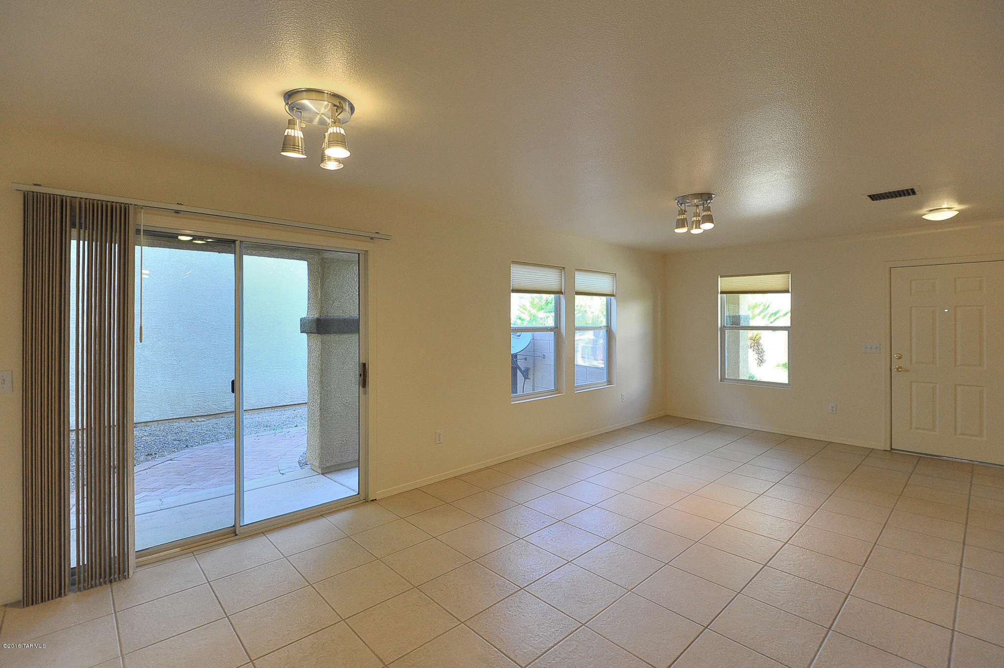 Cozy 2005 built 2 story home in Catalina Vista offers 1378 square feet, 3 bedrooms, 2 full baths and 2 car garage.   Great room opens to cute kitchen with nice dining area.  French door in dining room leads to back yard with covered patio.  Nice community located across from Ft. Lowell Part.  Great central location means easy access to the Foothills, Eastside or Downtown.  Ask about #2949