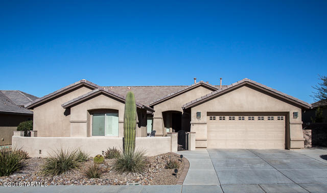WOW! This house has it all – Mountain Views, PRIVACY –adjacent to a wide arroyo, 3 Bedrooms (Extra Large Guest Room), 3 Baths, Den, Family Room off the Kitchen, Large Living/Dining Area, Casita with entry into the main house, AND a SEPARATE Workshop or Studio. 4’ EXPANDED GARAGE with Built-in Cabinets, Utility Sink, “Man Door” & Insulated Walls & Ceiling. 17” Tile thruout the House, Casita & Studio. Plantation Shutters thruout. Kitchen has Cherry Cabinets, 42” Uppers & Roll-Out Lowers, SS Appliances, Eng. Stone Counters, Crown Molding, Large Pantry with Bi-fold Doors & Kitchen Nook with Bay Window. Laundry Room has LOTS of Cabinets, Sink & EXTRA Dishwasher! The Guest Room was Expanded 4 Ft & Guest Bath has a Soaker Tub/Shower. The Master Bedroom has a Bay Window overlooking t Mountains with a door to the Expanded Patio. The Master Bath entry has Plantation Shutter Doorway. All Baths have Comfort-height toilets. The Relaxing Family Room has a Gas-Log Fireplace with Black Granite Surround. Low-E Double-Pane Windows, Soft Water, Stereo System Pre-Wired in Family Room, Master Bedroom & Guest Room (2 speakers/room). The house also has a Pre-Wired Security System. This house has it all! View this house and make it your home!