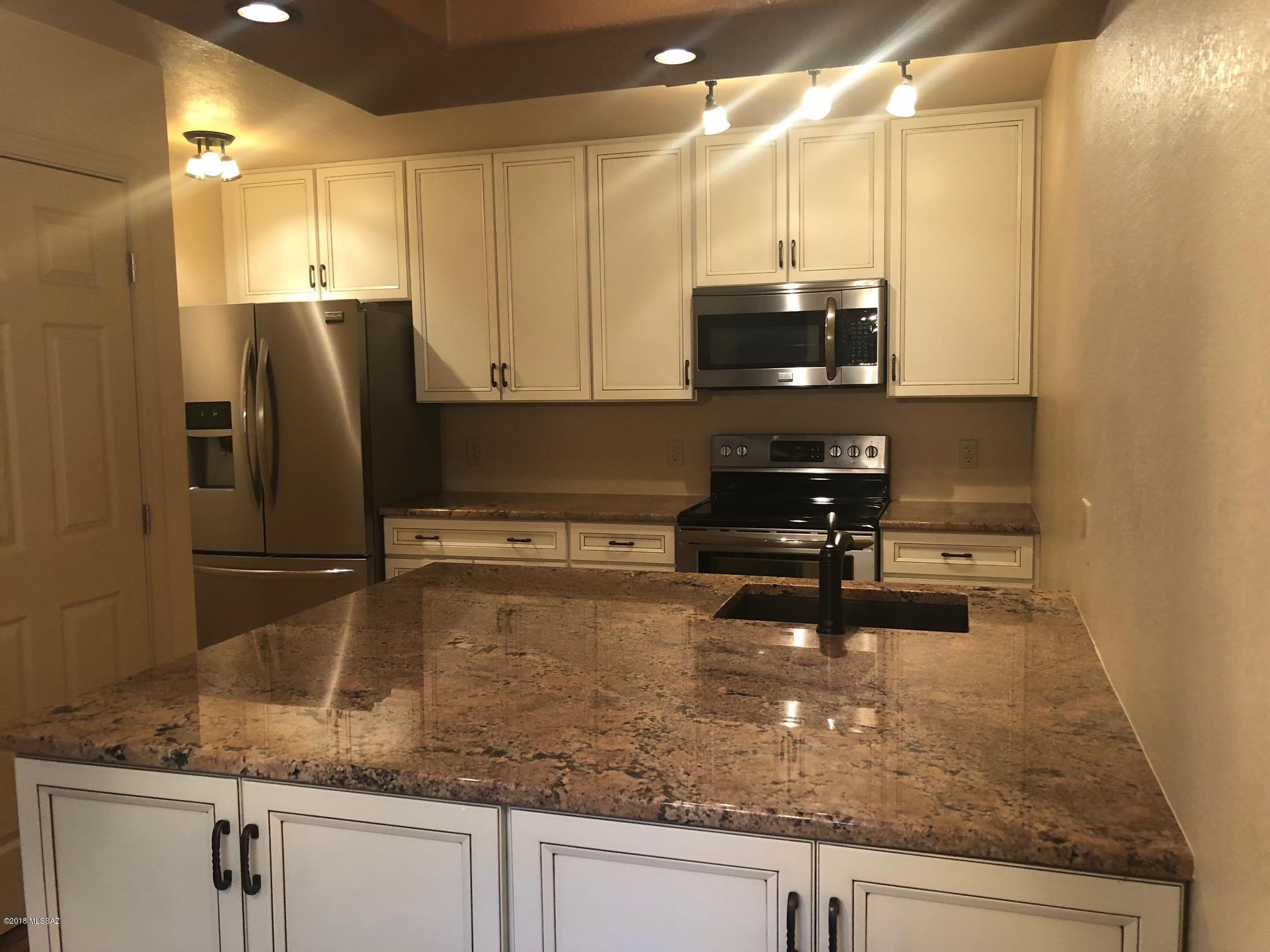 Unique upgraded and updated one bedroom condominium. Kitchen features designer cabinets, oversized granite kitchen island, stainless steel appliances and recessed lighting. Wood grain vinyl flooring throughout, no carpet!! Stackable full size washer and dryer. Bathroom features walk in shower. All located in Veranda at Ventana, a 24 hour gated access community featuring 2 resort style pools, fitness center, clubhouse and mature landscaping! Minutes to shopping, dining, hiking, +++!