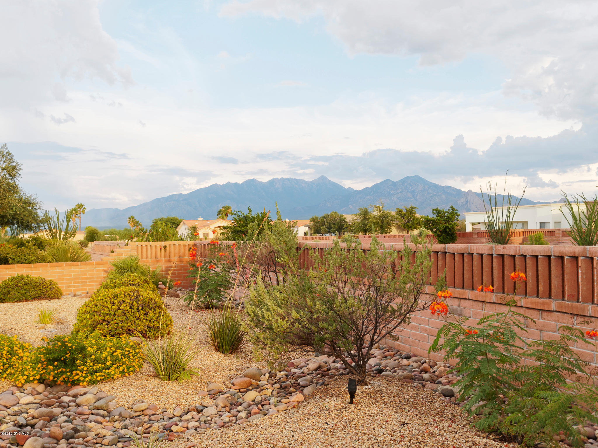 Beautiful home with views of the Santa Rita Mountains. 1 year transferable roof warranty, interior and exterior painted 2014, new plumbing 2014, and new hot water heater 2016. Termite Protection covered by the H.O.A. Furnishings negotiable. (SBOS)