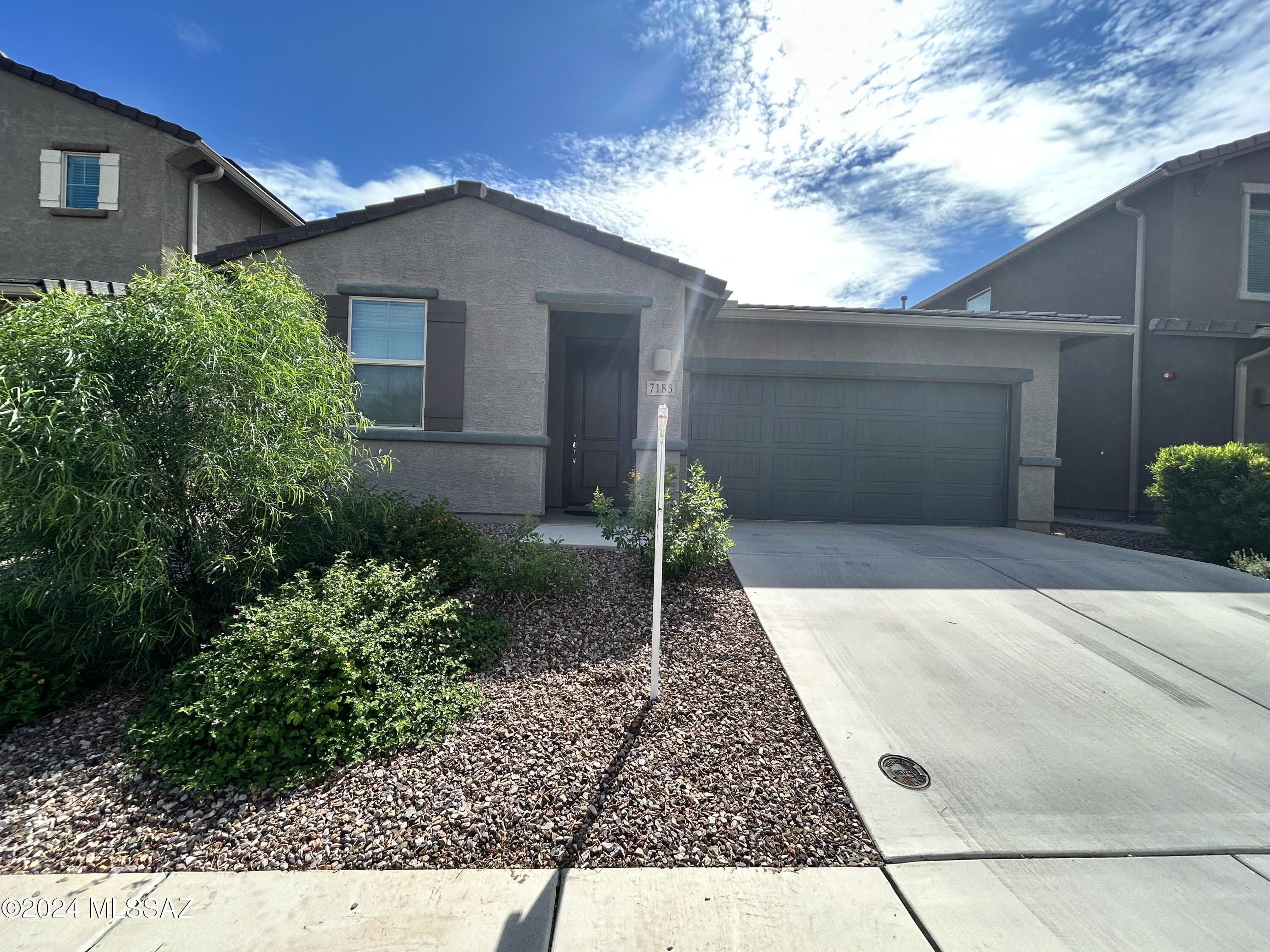 Wow! Search no further, this home is what you've been looking for! Conveniently located off Wilmot and I-10, close to DM, Raytheon, Amazon, and in the Vail School District, this 2027 sq. ft. 4bed/3 bath has it all! Light and airy open floor plan has great room with neutral tones, great kitchen with large island, Stainless Steel appliances, gas stove, large pantry, and plenty of cabinet and counter space. Split bedrooms features on-suite bedroom with full bathroom in the first half of the home! Two other bedrooms with plush carpet sit on opposite sides of a den/bonus room that would be perfect as a family room, extra quiet space or kids play area! Large primary bedroom includes bathroom with dual vanities and walk-in shower complete with huge walk-in closet. Laundry room with w/d hook-ups. Block fence back yard with covered patio, turf, and pavers for easy maintenance PLUS an established garden area with fruit trees! Pet Friendly and added pet door for convenience! All located in a largely sought after La Estancia Community with pools, basketball and pickleball courts and plenty of parks!